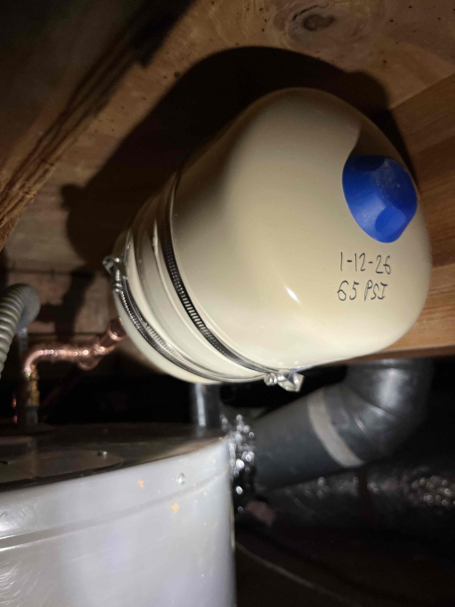 1/12/26:
Cut out combination of cast, copper, and pvc drain lines from the kitchen in the crawlspace. Stubbed out a new drain in the kitchen cabinet and ran three inch pvc to the other side of the crawlspace. Replaced water heater with a 50 gallon lowboy. Will return tomorrow to finish the last of the work quoted for the drain repipe. Made customer aware that the existing cast for the washing machine coming through the foundation is coming out evenly pitched and slightly lower than needed. Due to this, we can’t correct the slope of the existing line. 

1/13/26:
Returned and finished the under sink plumbing for the kitchen and guest bathroom. Pulled both toilets and replaced through the floor with pvc. Cut out all drain piping below the house. Connected the kitchen and guest bathroom bathroom to the main in new pvc. Capp new line going back towards the master bath. Will connect that bathroom group tomorrow on return. Made customer aware that pipes aren’t connected below any of the maste