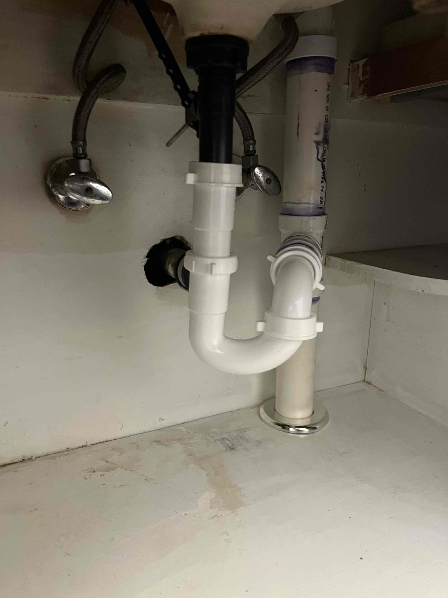 1/12/26:
Cut out combination of cast, copper, and pvc drain lines from the kitchen in the crawlspace. Stubbed out a new drain in the kitchen cabinet and ran three inch pvc to the other side of the crawlspace. Replaced water heater with a 50 gallon lowboy. Will return tomorrow to finish the last of the work quoted for the drain repipe. Made customer aware that the existing cast for the washing machine coming through the foundation is coming out evenly pitched and slightly lower than needed. Due to this, we can’t correct the slope of the existing line. 

1/13/26:
Returned and finished the under sink plumbing for the kitchen and guest bathroom. Pulled both toilets and replaced through the floor with pvc. Cut out all drain piping below the house. Connected the kitchen and guest bathroom bathroom to the main in new pvc. Capp new line going back towards the master bath. Will connect that bathroom group tomorrow on return. Made customer aware that pipes aren’t connected below any of the maste