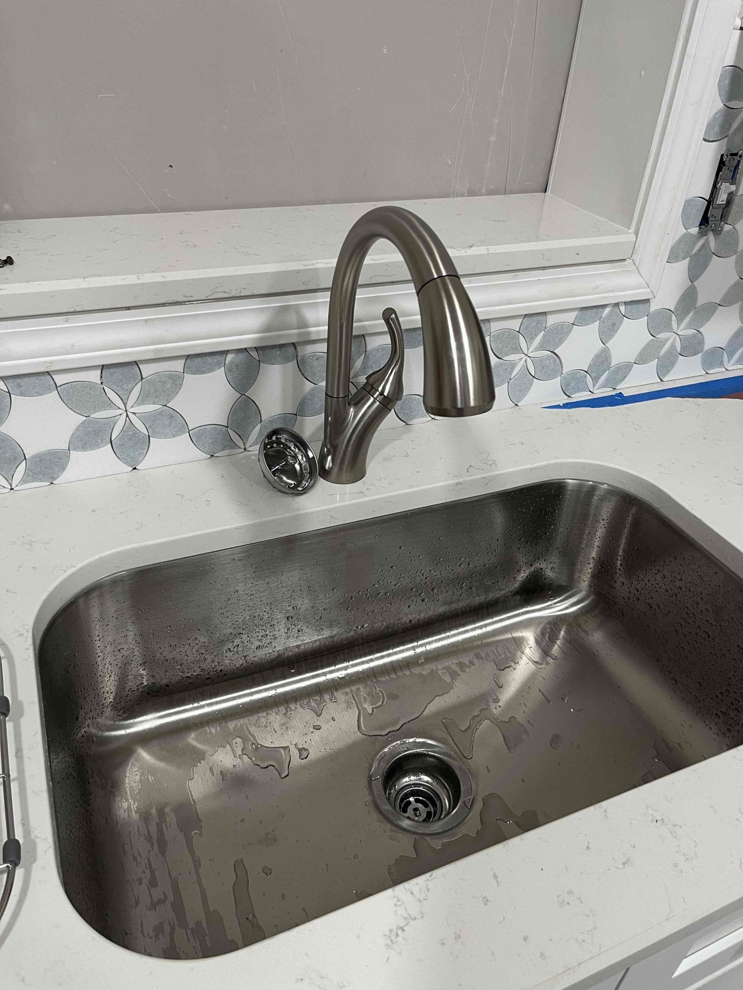 Customer had cold water throughout house. Tim spoke with customer on Tuesday and gave price to replace a 1 for 1 swap with a Rinnai tankless unit. Upon arrival, customer wanted their plumbing reconnected for their new kitchen. Informed customer that we don’t install dishwashers anymore. Advised that the water had to be reconnected in the kitchen cabinet for their new new dishwasher (when it’s installed) to be brought back up to code. Gave customer additional pricing to install a basket strainer, reinstall their old faucet from their kitchen, run a new trap into an AAV, and install a new stop for the dishwasher. Bundled the quoted work in a separate estimate. Customer approved quoted work in addition to the tankless unit. 

Description of work done:
- Removed the old Rinnai tankless water heater
- Installed a new Rinnai tankless water heater
- installed three new stops under the kitchen sink and drilled penetration in cabinet for their new water line for the new dishwasher (price for on