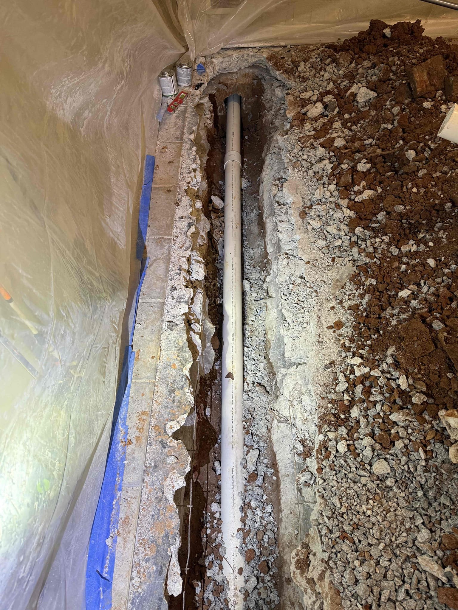 Customer approved estimate for drain replacement in slab, and installation of an exterior cleanout at root infiltration site.

On Friday, January 16, 2026, containment barriers were set and work area was protected. Concrete slab was open, deteriorated, cast-iron piping was removed, and new PVC was installed and tied into existing PVC in crawlspace, and to mainline leading out of house. line was camera inspected both upstream and downstream. We saw no significant defects noted beyond typical age. Concrete was in repoured and  area cleaned.



On Saturday, January 17, 2026, exterior excavation was completed at previous blockage location. Significant root infiltration was found and documented. A cleanout was installed at area where root was identified. Then camera inspection further down line confirmed more root infiltrations customer was then notified of root infiltrations.


All new piping was properly supported, soil compacted, as well as all piping was tested. Work was performed profe