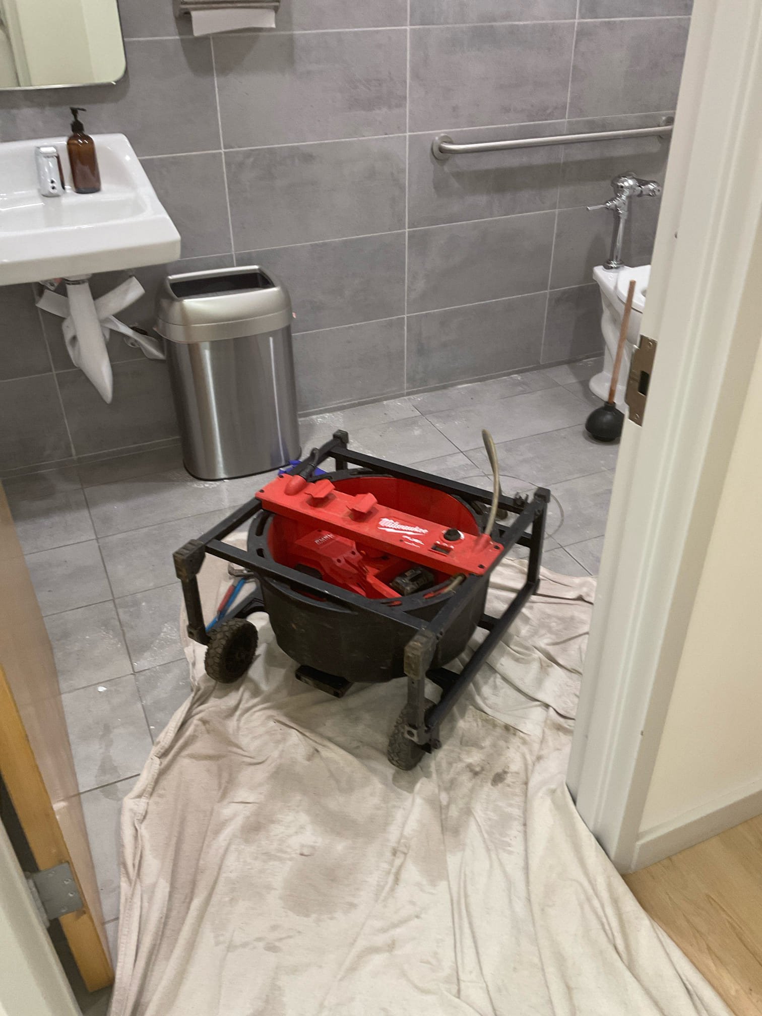 Today we arrived , both toilet in entire office are backed up , overflowed in the rear restroom floor drain , problem is different than last visit back in Aug was only in front restroom behind the waiting area , we ran the big chain snake , cleared blockage today , pulled back with tampons type stuff ,did camera inspection found issue still with pitch of the line , pipe pitch need correct for permanent fix with concrete cutting , remove , install new pipe 