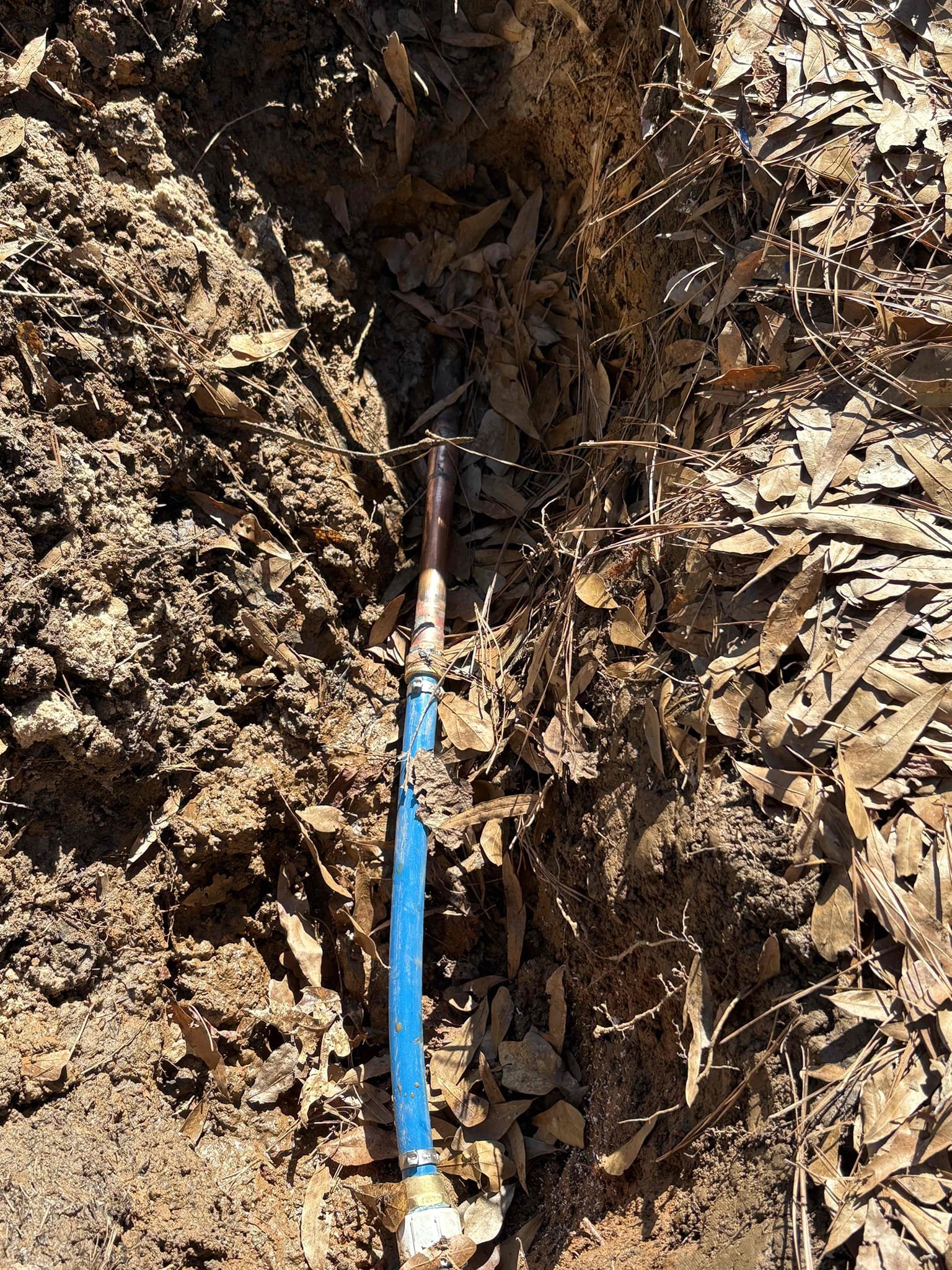 Client called us out due to a leak on their main water service line just in front of the water meter. We had previously done a no warranty repair in Same area right around a year ago. It had a slight leak on side of the copper fitting. The old hole was backfilled with sand and dirt. Due to sand trapping condensation and it being abrasive, it is not ideal for backfilling holes with metal water lines as it rubbing on the pipes will cause slight leaks. Recommend client get a few bags of potting soil or some fill dirt to put back in the hole with the small bit of copper water piping coming from the water meter. 

Home water pressure perfect at 60 psi, safe range is 50-79 psi.

1 YR WARRANTY PER HUNTER
