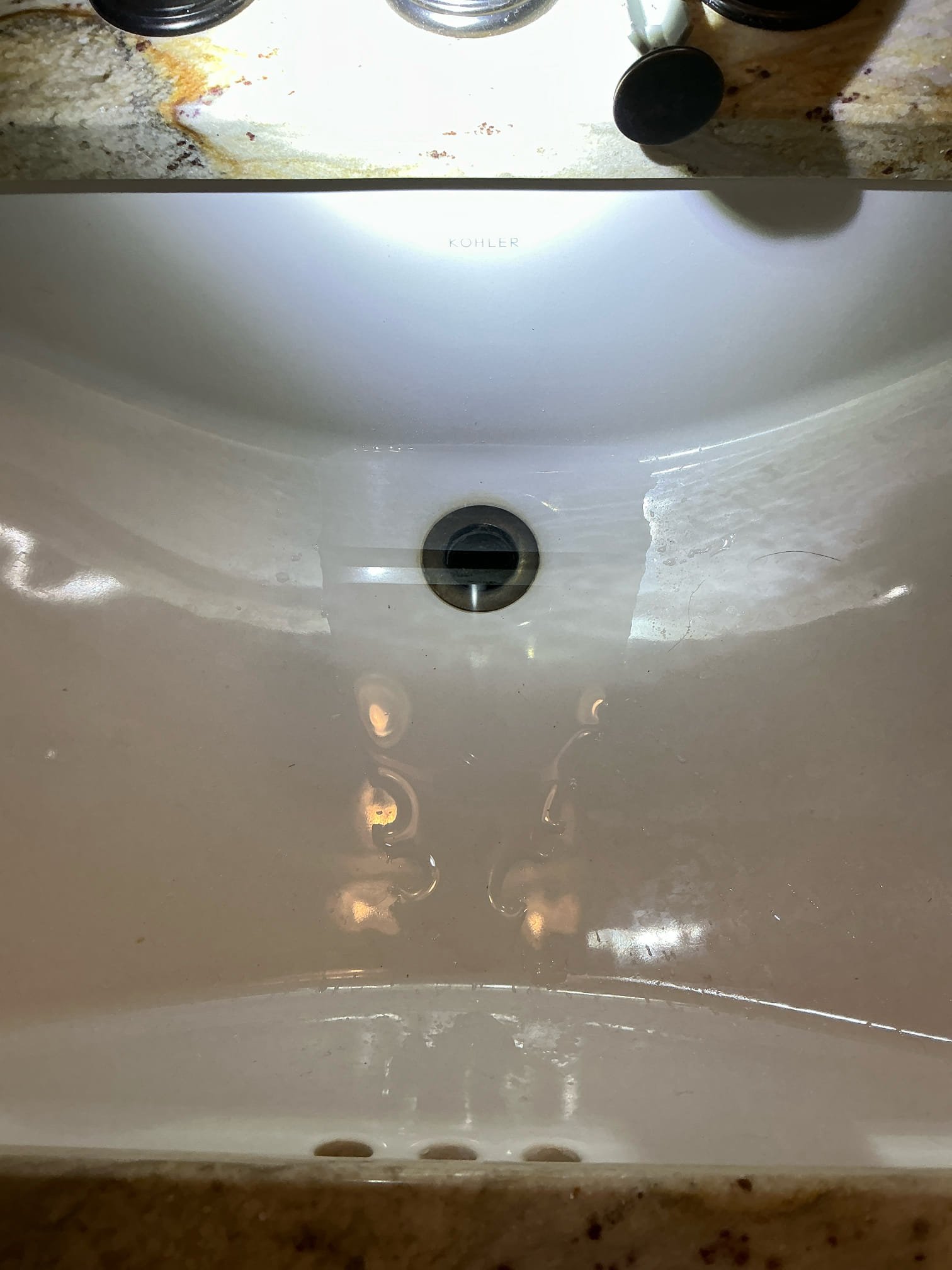 Client called us out due to their left hand master bathroom lavatory sink drain clogging up and holding water. They tried a hand snake but were unable to get any relief. I ran my small chain snake and also could not get any relief. We got the sewer camera down the line as far as we could, then located it. We found that lavatory on top floor runs all the way down and ties into the system in the basement, just behind the kitchen tie in. We discovered that entire trunk line catching all the upstairs fixtures to be completely full of grease from the kitchen line. We cleaned out a lot of grease out of the line and then used water hose to wash it out further. The line was a lot more clear of grease, but it was still backing up when I had the hose running for a minute. Using my flashlight I could see at the other end of the pipe that it is still caked with grease. Both kitchen and the other fixtures should drain normally, but sooner or later that large amount of grease left on other end of li