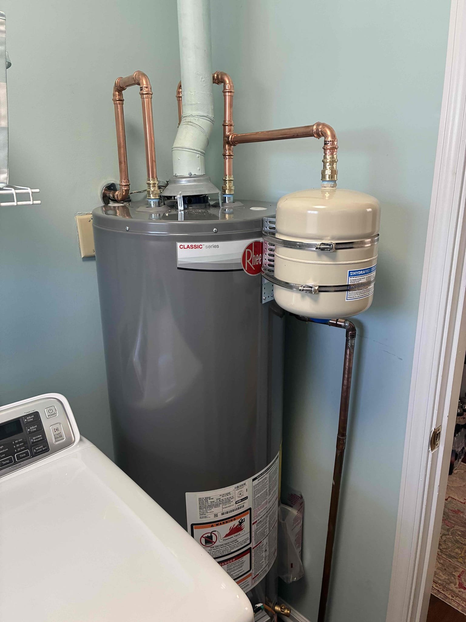 Customer had popping sound coming from 10 year-old  water heater. Explain to customer about sediment in tank and reason for popping sounds gave customer options to replace heater. Also found pressure to be at 90 psi along with a bad thermal expansion tank in crawlspace. Give additional options for repairs/replacements on these items. Replaced heater with Rheem 40 gallon gas water heater with new ball valve and Thermal expansion tank. Also relocated thermal expansion tank from crawlspace to laundry room with heater. Installed PRV in crawlspace with new ball valve set pressure to 60. Cap gas line going to light pole in front of house. after work was complete checked all areas for leaks and proper function. 