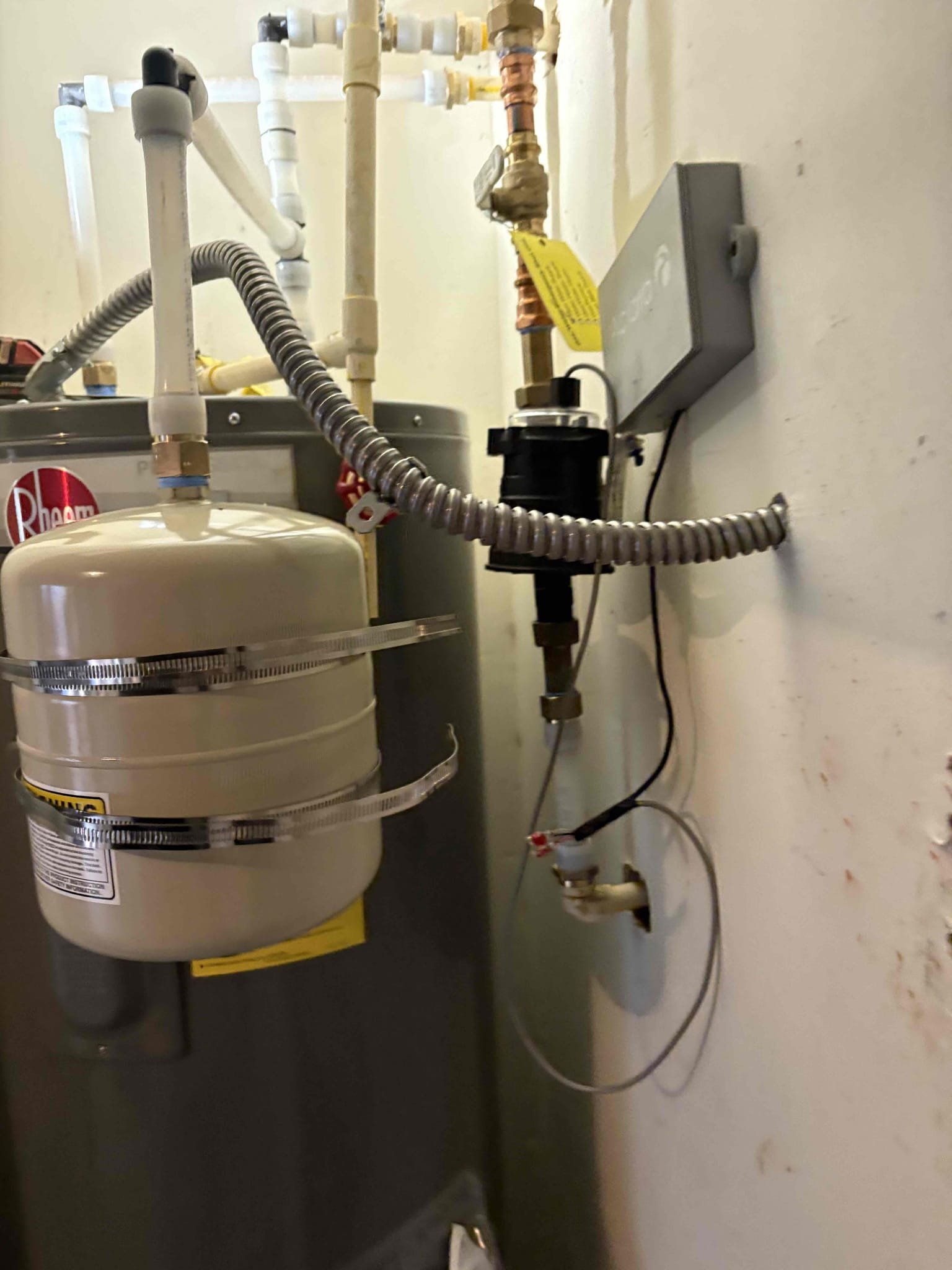 Client called us out due to their 9 yr old 50 gal ao smith electric water heater having some issues inconsistently heating/working properly without tripping the reset button. Checked home water pressure and it was perfect at 55 psi, safe range is 50-79psi. We replaced that failed water heater on pedestal in garage on cpvc with new Rheem pro series 50 gal electric water heater installed up to code in new water heater pan with new ball valve shutoff and new properly supported thermal expansion tank per code. We did have to remove the meter on the wall in order to get old one out and new one in. After installation we put it back on and tested. No leaks or issues. Got all air out and turned power on. 

6 yr manufacturer warranty 
2 yr labor with Service membership!