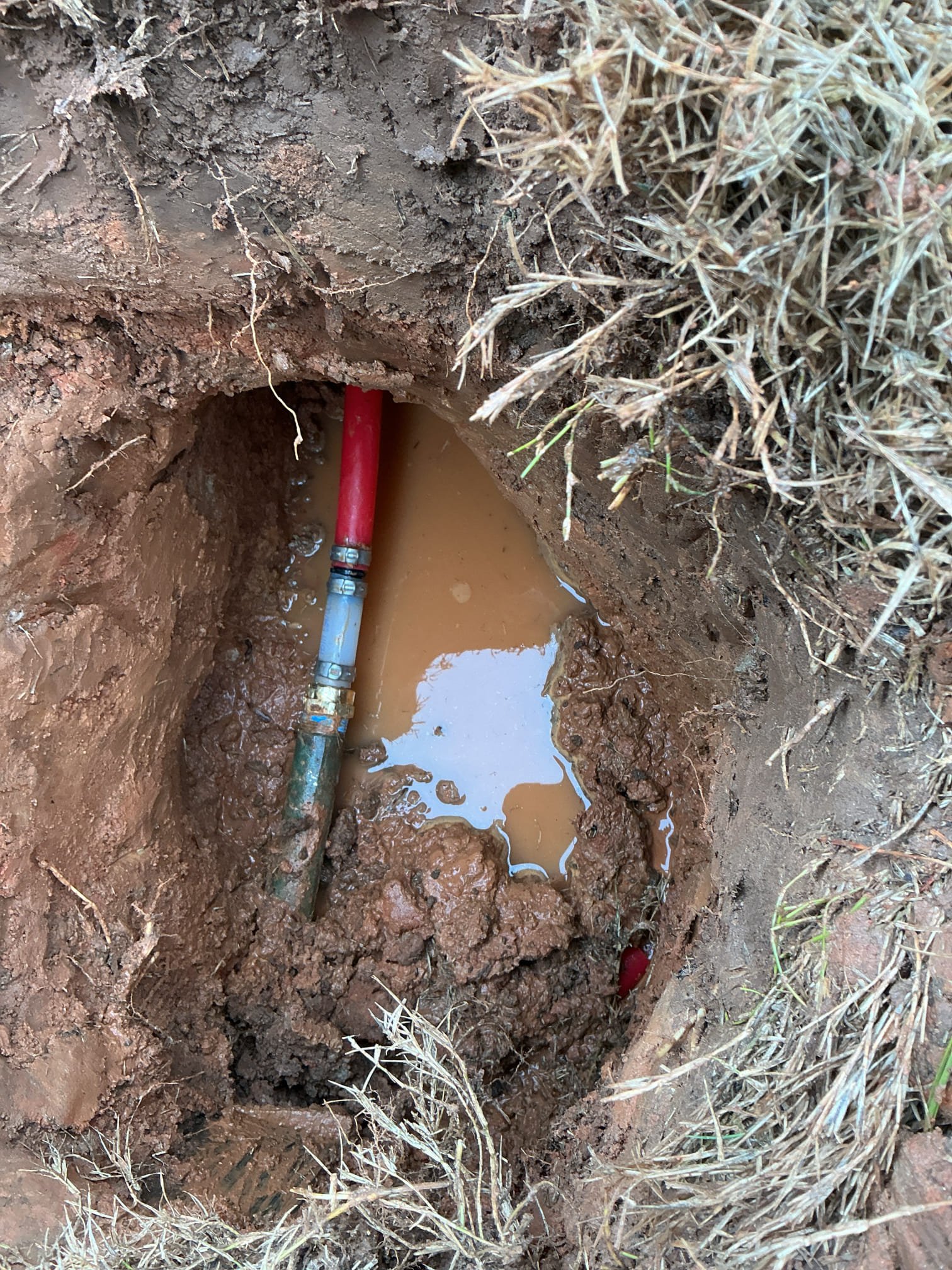 Customer wanted to identify material of water service dug down to find pex for water service. Bad fitting in ground when digging down fitting started to leak replaced small section and checked for leaks.