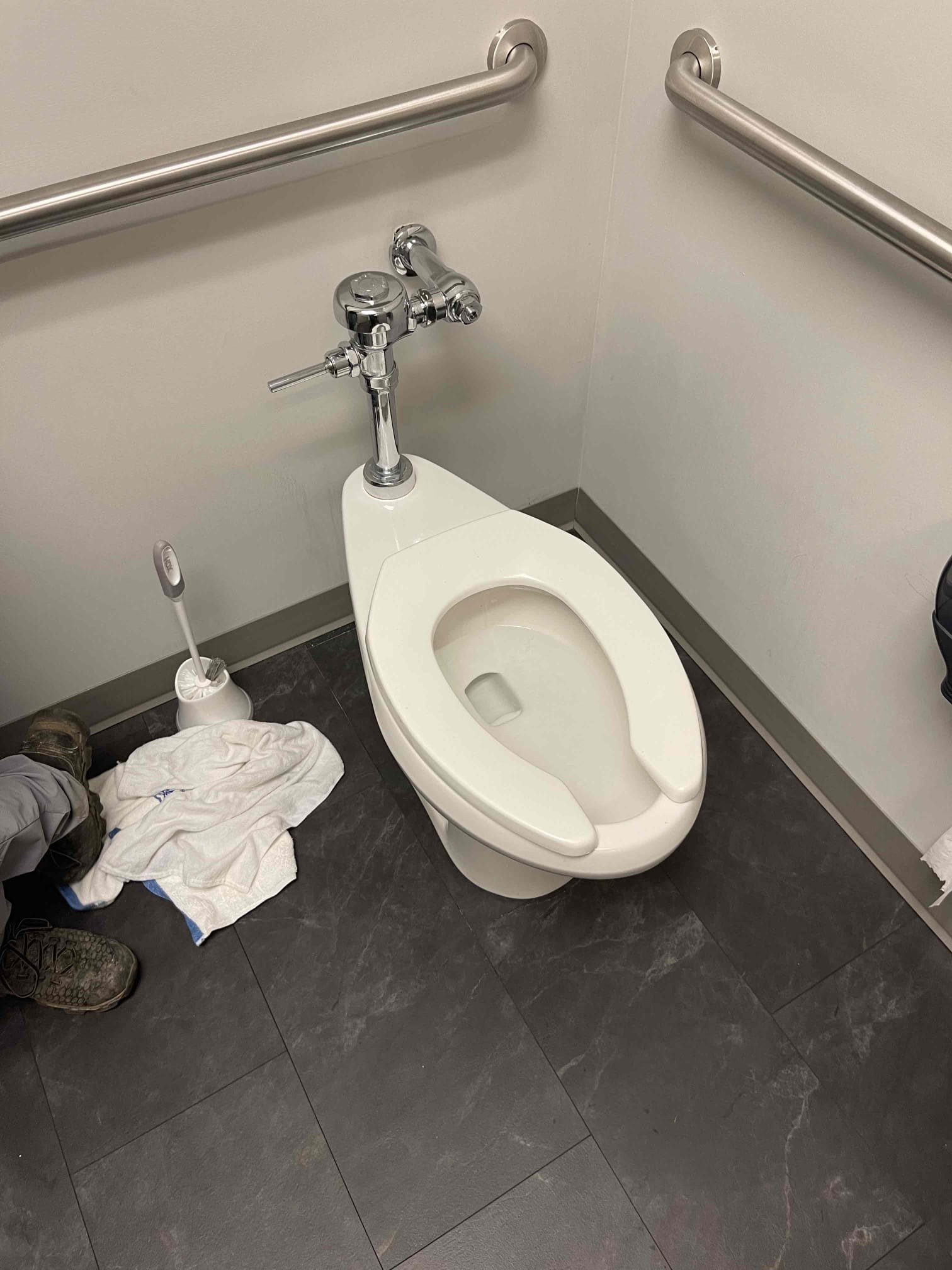 Flushometer randomly leaking from the housing after sitting idle for a few minutes. Customer elected to replace it. Replaced the entire Flushometer down to the spud. Did not replace the stop valve as that would require a building shut down. Tested multiple times and took video showing replaced unit with no leaks and operating normally. 