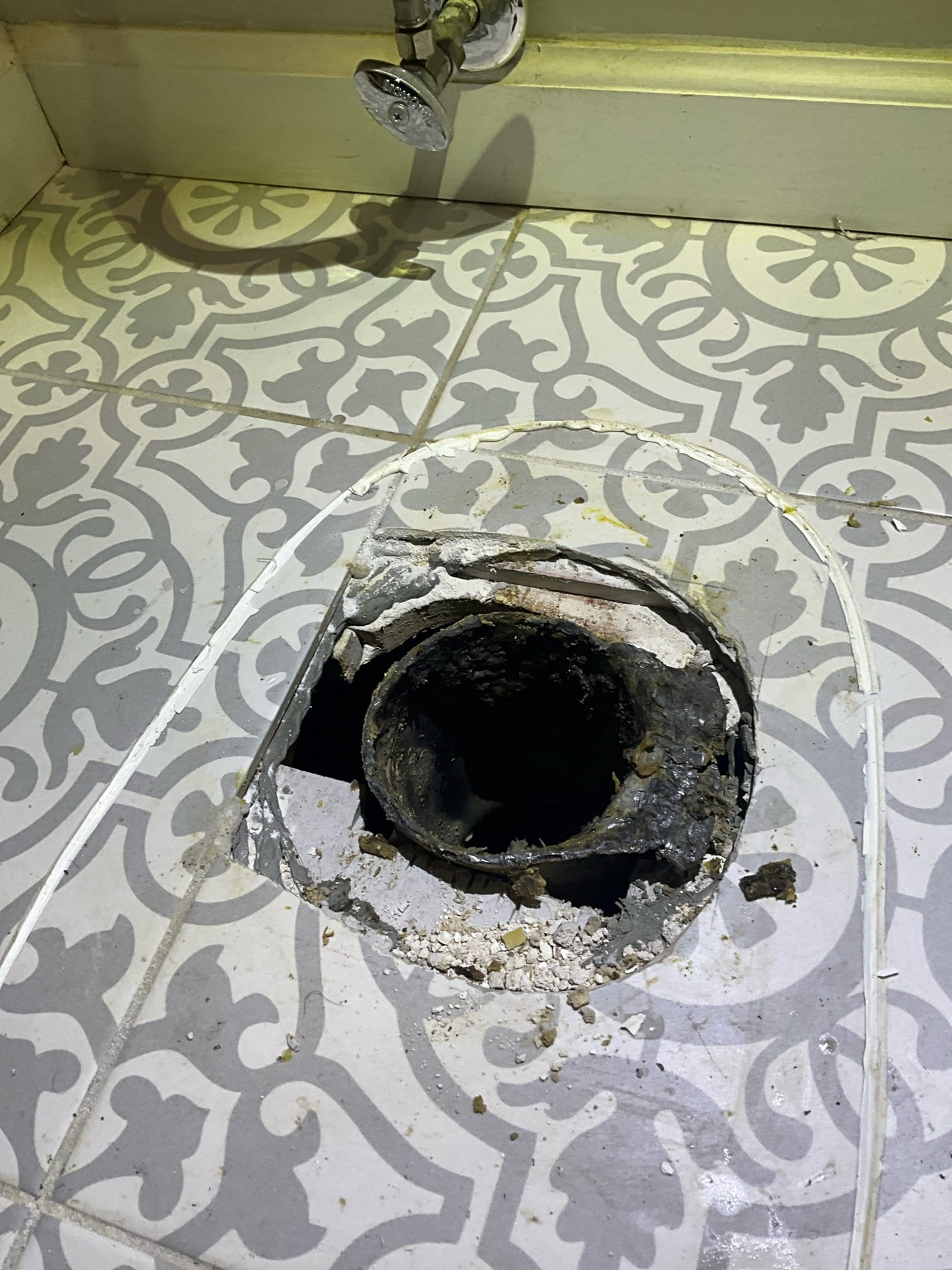 Customer had two bathroom groups upstairs that were backing up. Flushed a toilet and noted water backing up in the tub. Gave camper a price to pull a toilet and run the camera to determine the issue. Informed customer that if I could, I would attempt to push through with the camera, but if not, then additional pricing and steps would be necessary to clear the stoppage. Cautioned customer that the flange may need attention when toilet is pulled, and that we won’t know until we pull the toilet. The flange was stacked, but we installed a pvc flange with rubber seal inside of lead pipe to correct the issue as a courtesy. Tirade for 1-2 hours to get the camera to turn through the double wye the toilets are on but was unable to make the turn with the camera. This made it unsafe to put any cable machines in the line in the event that the machine runs through the other toilet. The vent going up through the roof was cast. This can’t be safely cut without risking the boot causing a leak from the