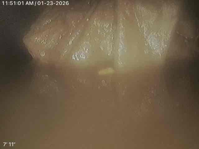 Customer had two bathroom groups upstairs that were backing up. Flushed a toilet and noted water backing up in the tub. Gave camper a price to pull a toilet and run the camera to determine the issue. Informed customer that if I could, I would attempt to push through with the camera, but if not, then additional pricing and steps would be necessary to clear the stoppage. Cautioned customer that the flange may need attention when toilet is pulled, and that we won’t know until we pull the toilet. The flange was stacked, but we installed a pvc flange with rubber seal inside of lead pipe to correct the issue as a courtesy. Tirade for 1-2 hours to get the camera to turn through the double wye the toilets are on but was unable to make the turn with the camera. This made it unsafe to put any cable machines in the line in the event that the machine runs through the other toilet. The vent going up through the roof was cast. This can’t be safely cut without risking the boot causing a leak from the