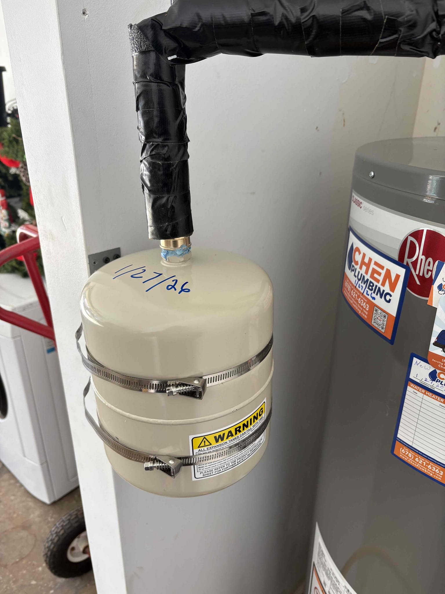 Returned today to finish moving the expansion tank to the wall and insulating the piping per inspectors request. 