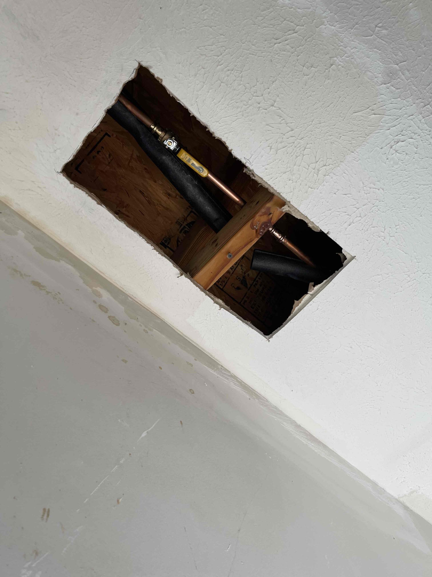 No warranty to freeze damage or for high pressure! Solder join in ball valve froze and broke apart. Caused a lot of drywall to come down in the garage. We cut out leaking valve and repipe section. Tested to ensure proper function and a leak free installation. Water pressure to home is 135 psi. Left quote to replace water heater and PRV. 