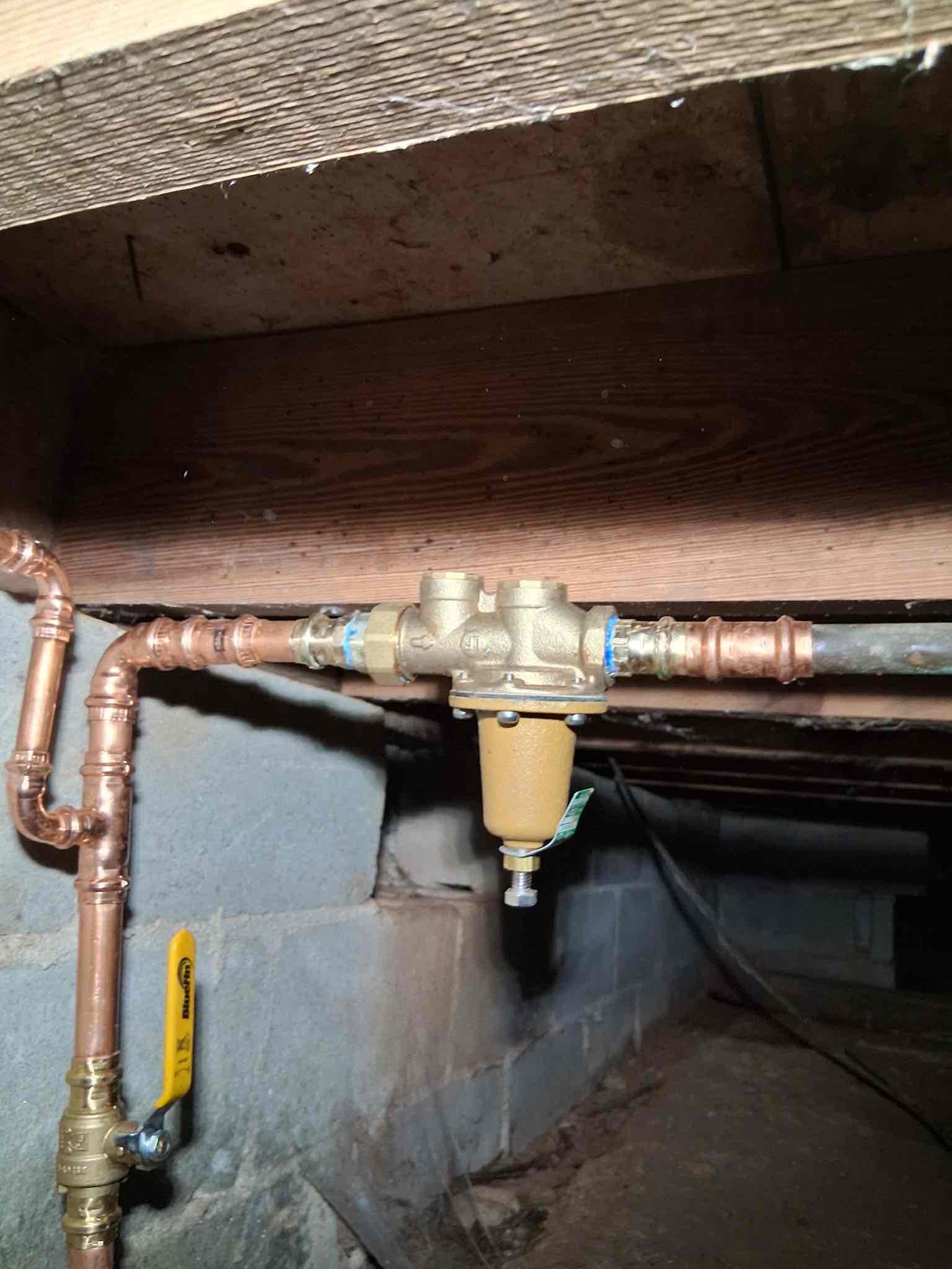 Client called us out today due to their hose bib on front of home bursting from the cold weather. While investigating in crawlspace I found another leak just beneath the tub shower. In closet behind tub is the nat gas water heater. It seems the copper pipe running up to the water heater is leaking slowly right around floor level in crawl space, due to it being touching an old galvanized pipe for long period of time. Will leave estimate for that repair, as well as repiping all the old drainage pipe in crawlspace. If client does finance job, wouldn’t be bad idea to consider the water heater also. It’s at least 10 yrs old, estimate included for that as well.

1 yr warranty on today’s work.


Checked water pressure and it was over 100 psi, safe range is 50-79 psi. Home did not have a pressure reducing valve which is why pressure was so high. We turned off water at meter, to then go in crawlspace and pipe in the new whole home water shutoff ball valve, new pressure reducing valve, new tee f