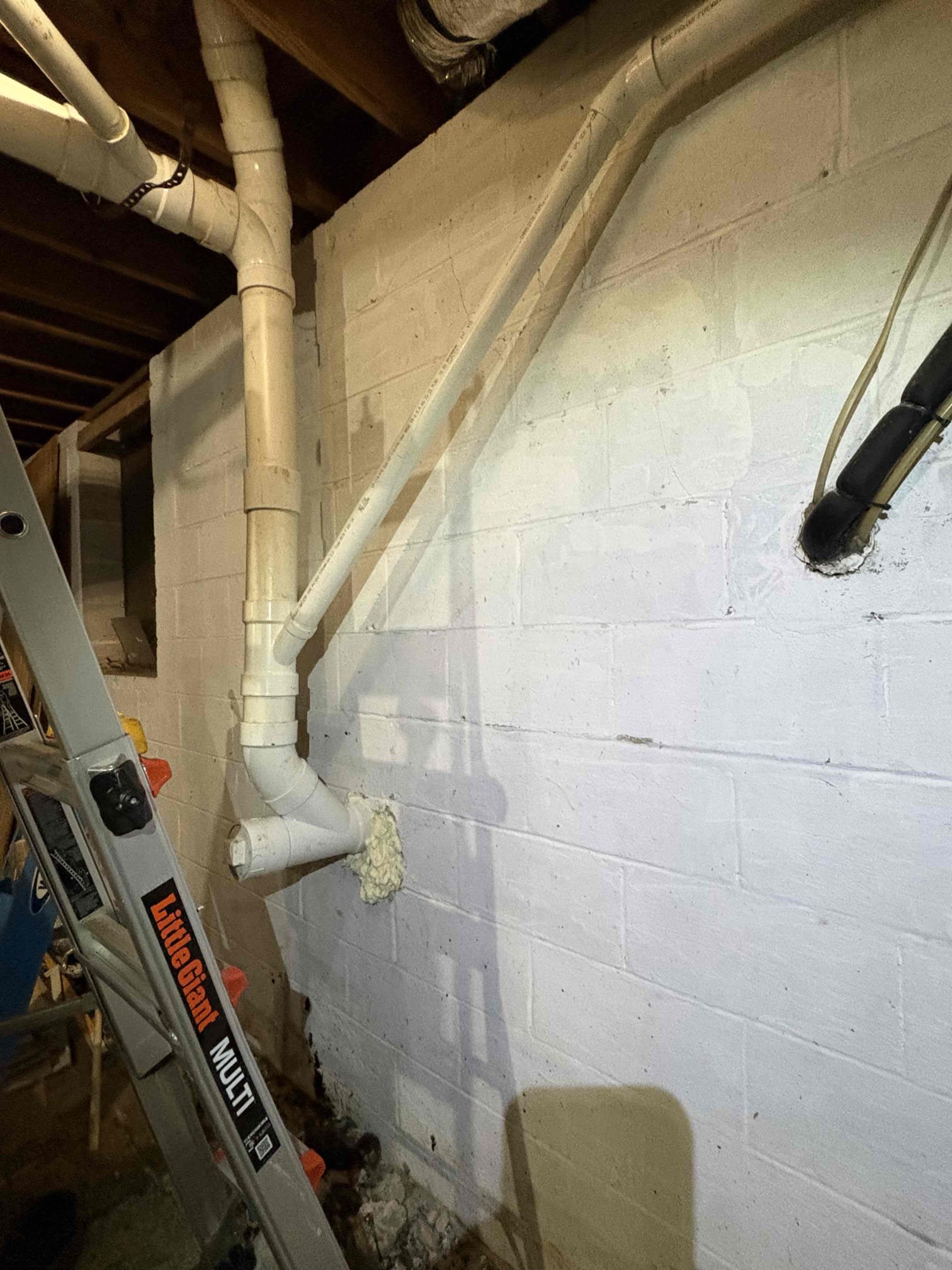 Cast iron drains repipe. 1 bathroom with long kitchen run and digging up outside to replace the cast iron in the ground to new PVC pipe. We dropped all the old cast iron piping to then begin running our new pvc drains properly supported and falling the correct way. New toilet flange and tied onto the 4” vent through the roof. Vent slid down so, so we used tar on the roof to make sure that penetration is sealed. Where we took the new main line out of back of home, on both sides sealed with spray foam. Then outside I tarred all around the pipe to waterproof our penetration and inside I put hydraulic cement over the spray foam to waterproof. For the long kitchen run we mounted 2”x4” boards to the block wall with tapcons so we had something sturdy and better looking that old supports. Once all work was complete, we tested our work. Ran each fixture In home and everything is working as it should with no leaks. Backfilled outside to grade as best we could. 



We warranty full replacements f