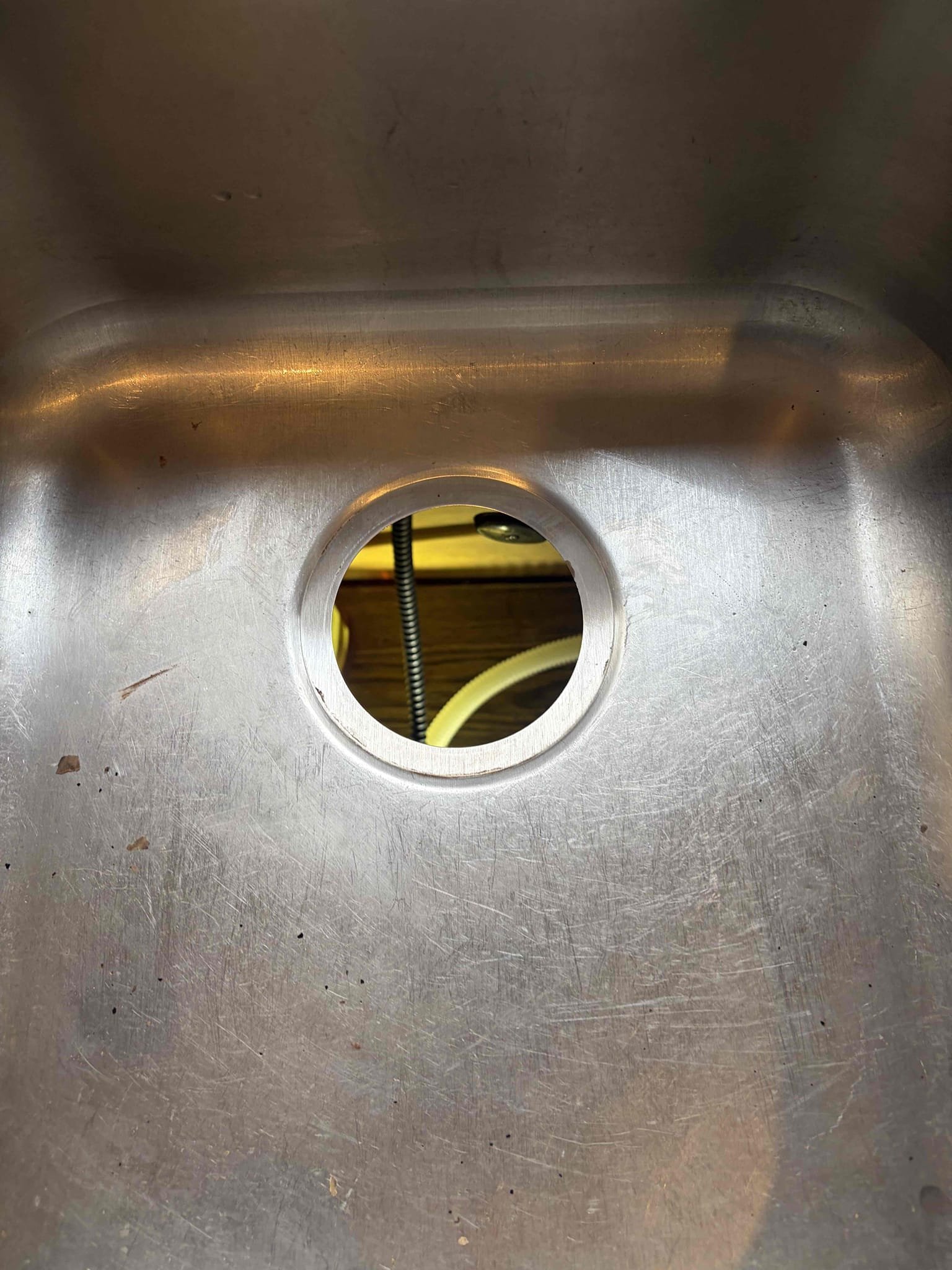 For this customer, they had a garbage disposal in the kitchen sink that would only hum so therefore knew exactly what needed to be done. The garbage disposal needed to be replaced however, we did try to unjam it prior to replacing it. Replace the unit with a brand new one half horsepower hooked everything up at a new wire nuts to the electrical components new waist bracket cleaned up the area use the dropcloth to hold the tools what’s installed? There are no leaks. 