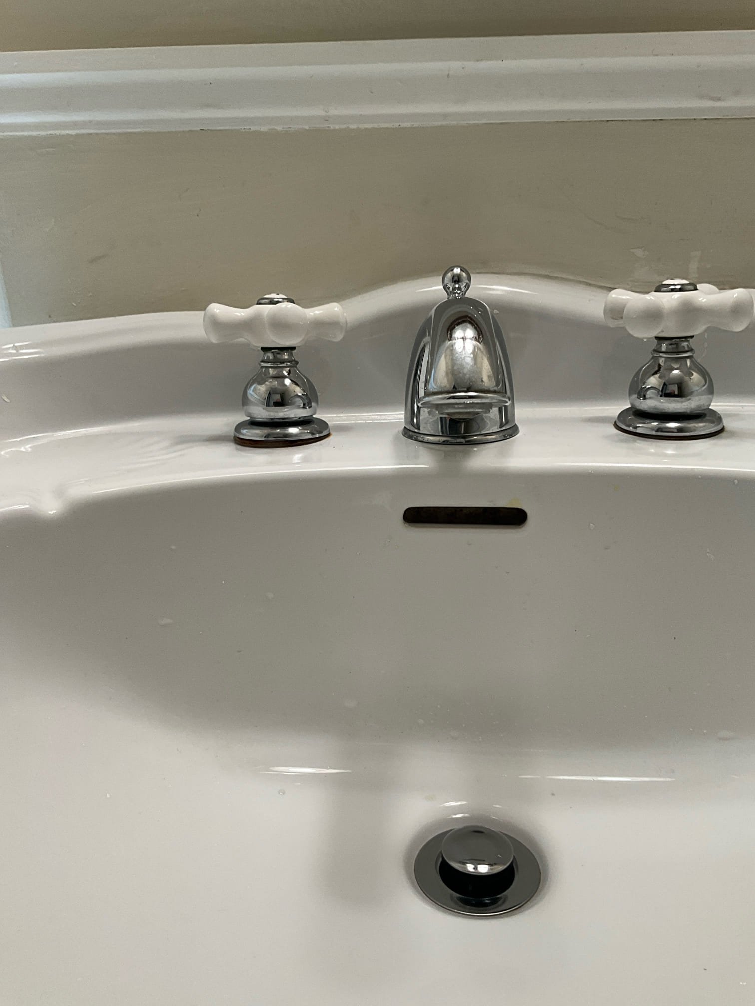 Call for leak under sink.

Arrived and met with Isabell, the tenant for this property. She said there is occasionally a leak from behind the sink in the main level powder room.

Inspection revealed the following: rust and deterioration present on faucet stems and housing. Pop up assembly appears to have been recently replaced. The pipe up trip lever housing is leaking. I did briefly attempt to reset but leak persisted. I believe there may be a small crack, but I am unable to inspect further wi5out removing it or moving the pedestal sink. 

I am providing estimates to replace the pop up, as well as the faucet.

After speaking with Ms. Sylvia, she elected to replace the pop up drain assembly. I removed the failed plastic assembly and installed a better quality brass assembly. I tested for leaks and ensured work space was cleaned up.