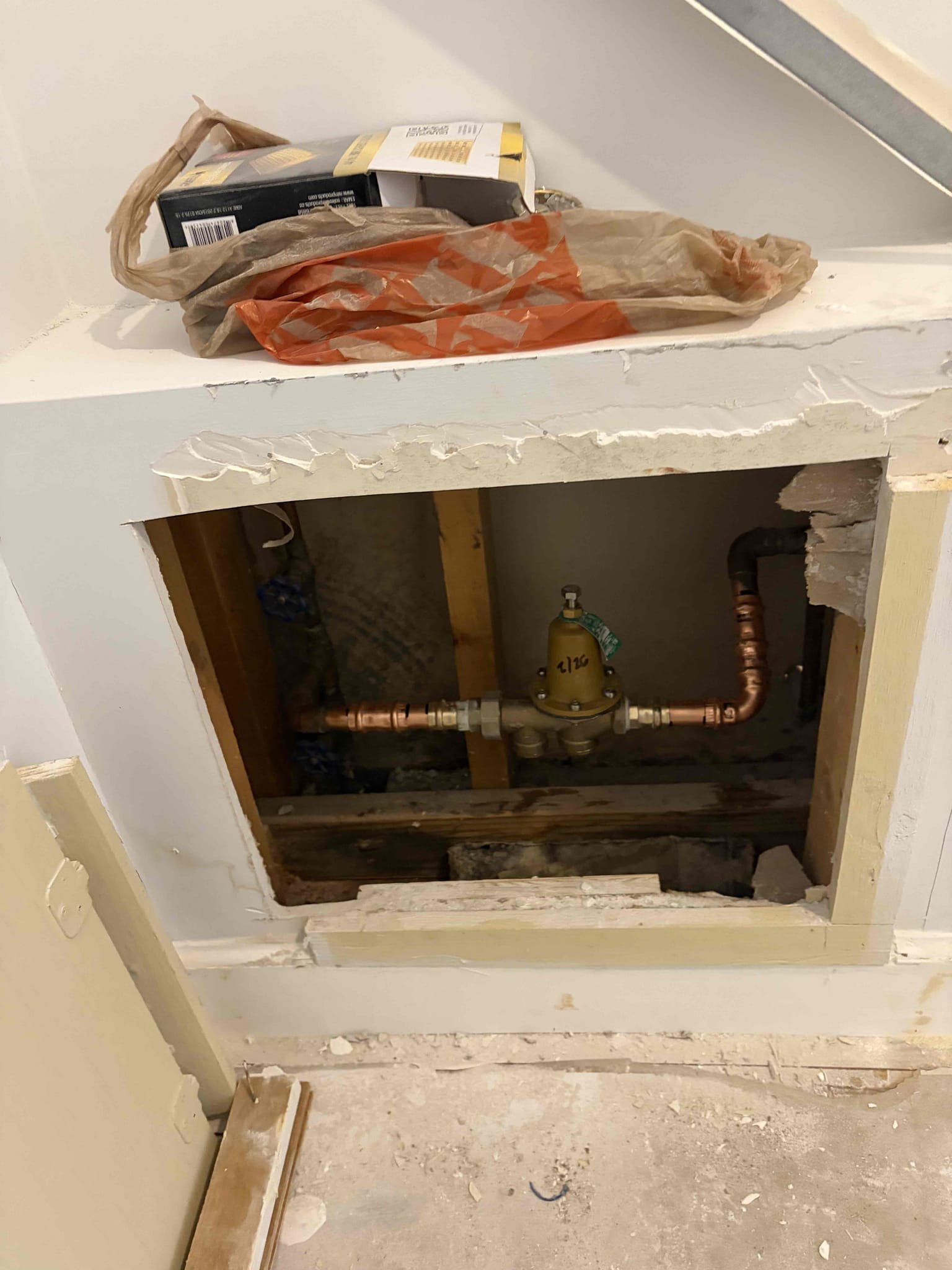 This job I worked on the pressure reducing valve, the pressure reducing valve in the small little closet. Within another little small closet. There was a Zurn PRV that had leaked or was about to leak the PRV needed to be replaced because the water pressure was reading at about 110 psi Which is not recommended in the state of Georgia. It has to be under 80 so therefore we replaced the pressure reducing valve with a brand new watts 25AUB once installed there are no leaks. We didn’t end up installing a shut off valve as well. There wasn’t that much space to do so All the fittings have been crimped. There are no leaks. Make sure that there are no leaks. Had to open up the door to the little closet, and I use my multitool to make bigger access in order to access the full piping system in the area so that is exactly what we did once installed. There are no leaks. 