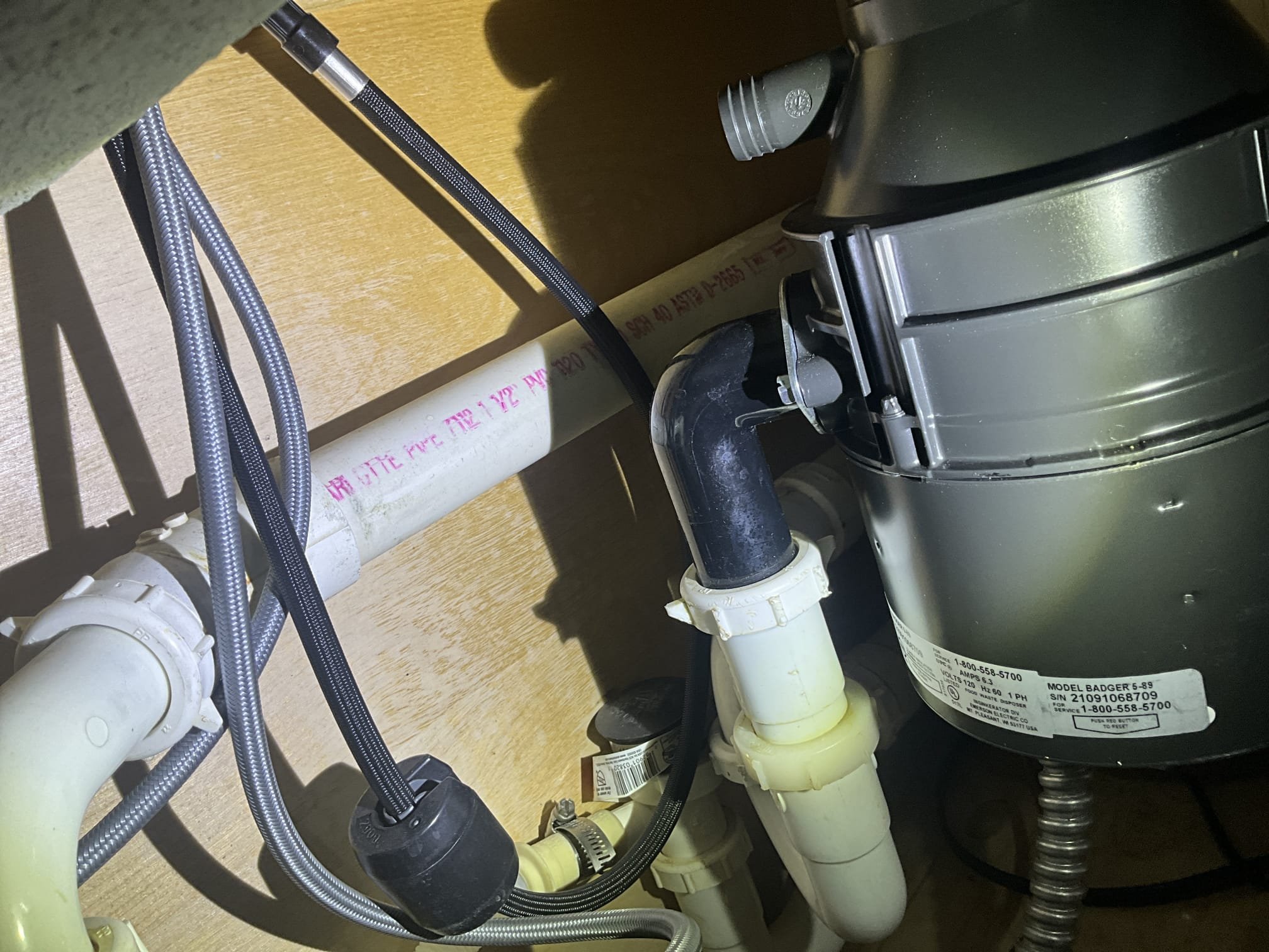 Customer had a disposal under the kitchen that was jammed. Inspected the platform the blades were on and saw a lot of wear. Customer was unsure of the age of the unit, so replacement was recommended. City had the water off at the street for the neighborhood due to a break on a city line. Was unable to test the drains below the sink or check water pressure. Customer has two water heaters in the basement. One was 2014 and one was 2020. Recommended and left quote for replacing the older unit on the left and installing a thermal expansion tank that is sized correctly for two 40 gallon heaters. Informed customer that the best way to safely open water to house when the city turns their line back on is to open a tub to safely let dirt and debris open. Opened tub for customer because the city had turned the water back on. 