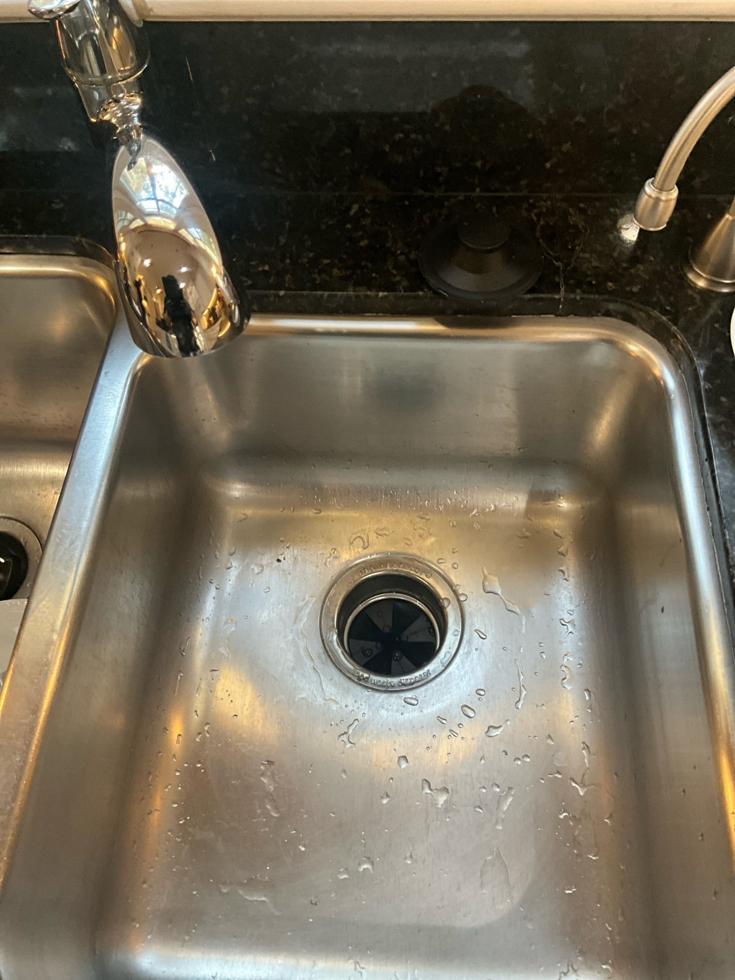 Customer had a disposal under the kitchen that was jammed. Inspected the platform the blades were on and saw a lot of wear. Customer was unsure of the age of the unit, so replacement was recommended. City had the water off at the street for the neighborhood due to a break on a city line. Was unable to test the drains below the sink or check water pressure. Customer has two water heaters in the basement. One was 2014 and one was 2020. Recommended and left quote for replacing the older unit on the left and installing a thermal expansion tank that is sized correctly for two 40 gallon heaters. Informed customer that the best way to safely open water to house when the city turns their line back on is to open a tub to safely let dirt and debris open. Opened tub for customer because the city had turned the water back on. 