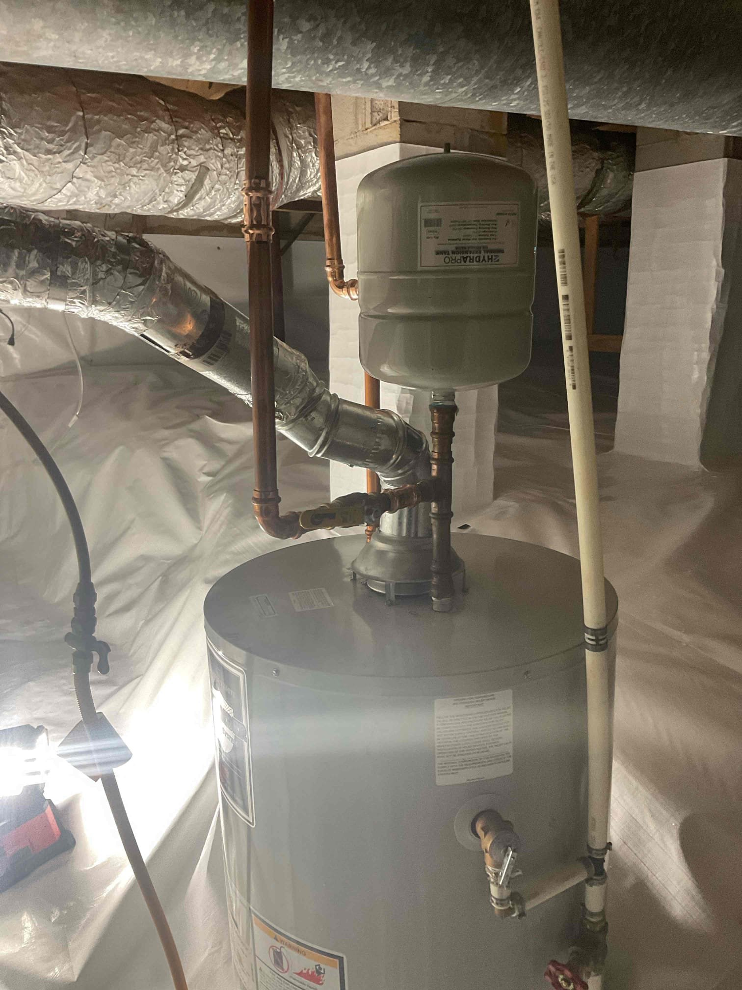 This job came back out to the customers home to reconnect the water heater in the crawlspace because the people doing the encapsulation have finished what they were needing to be done so therefore, I set the water heater back into the pan that connected the water lines, reconnecting the gas line and then reconnecting the vent as well used all proper connections once installed there are no leaks the same way it came out was the same way it was put in. There’s no gas or water leak used three screws per joint on every event connection that was taken off. CUSTOMER’s water pressure is at 60 psi. Set the water heater to the temperature of “a” which is indicating 120°F.  No further issues at this time.