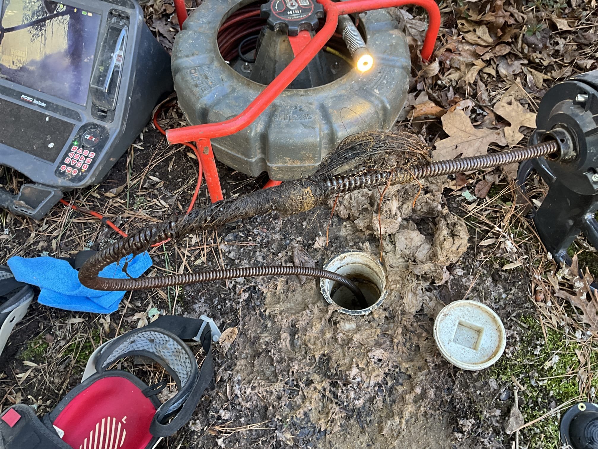 Customer had a main stoppage on her sewer line in the yard. Attempted to run camera first and was unable to obtain visibility due to the nature of the blockage. Ran a sewer machine to cut out the roots. Reinspected the line with the camera and found a large root intrusion at the tap. Recommended digging and repair the section and installing a cleanout for the city to inspect where a utility went through the 6 inch line further down. Installed a popper for the cleanout in the meantime.