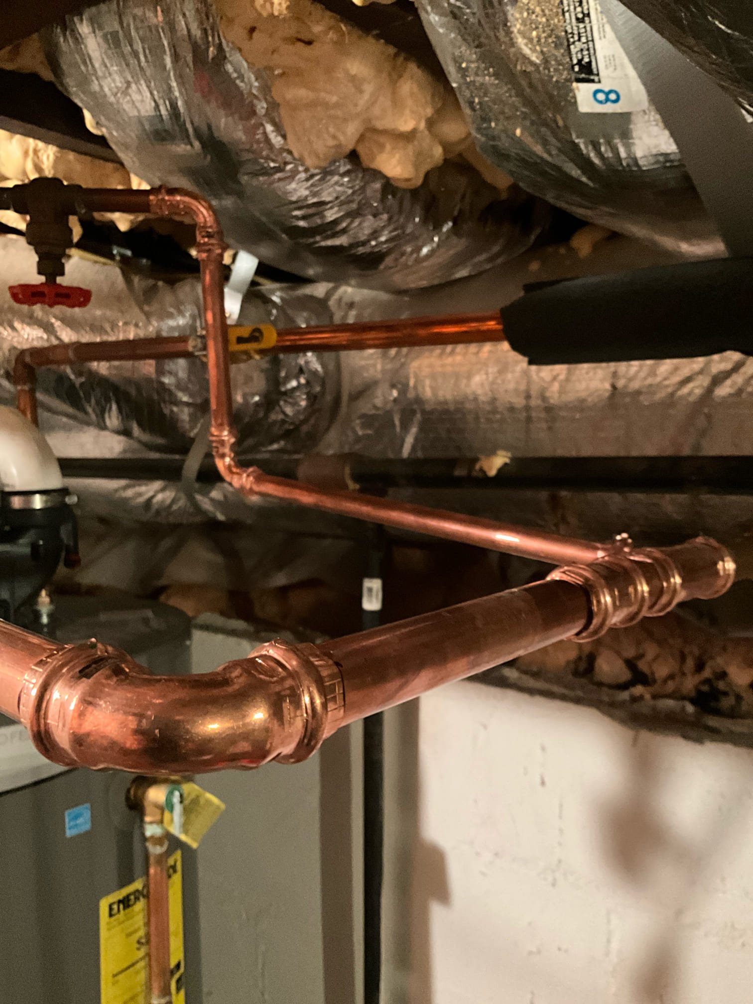 Call for cold water always being hot.

I arrived and met with Mr. And Mrs. Young. Mr. Young states that the cold water is always hot at nearly every fixture. When testing fixtures I found that most of them were extremely hot on the hot and cold side. 

In September of 2025 Chen plumbing performed some work, which included replacing a water heater, and the addition of a recirculating pump. The pump was installed with a crossover tee in the master bathroom. Pump is functioning correctly. 

Difficulties in assessing issue: Spray foam is sprayed throughout home. The home is also old enough to that there have been many repairs and changes, and I am unable to see everything. I also cannot determine why the original recirculating system was disconnected and put out of service. When I found the discontinued service line. It was explained that they were having some kind of issue and had contractors disconnect it in years past. A second water heater was installed several years ago with remodel w