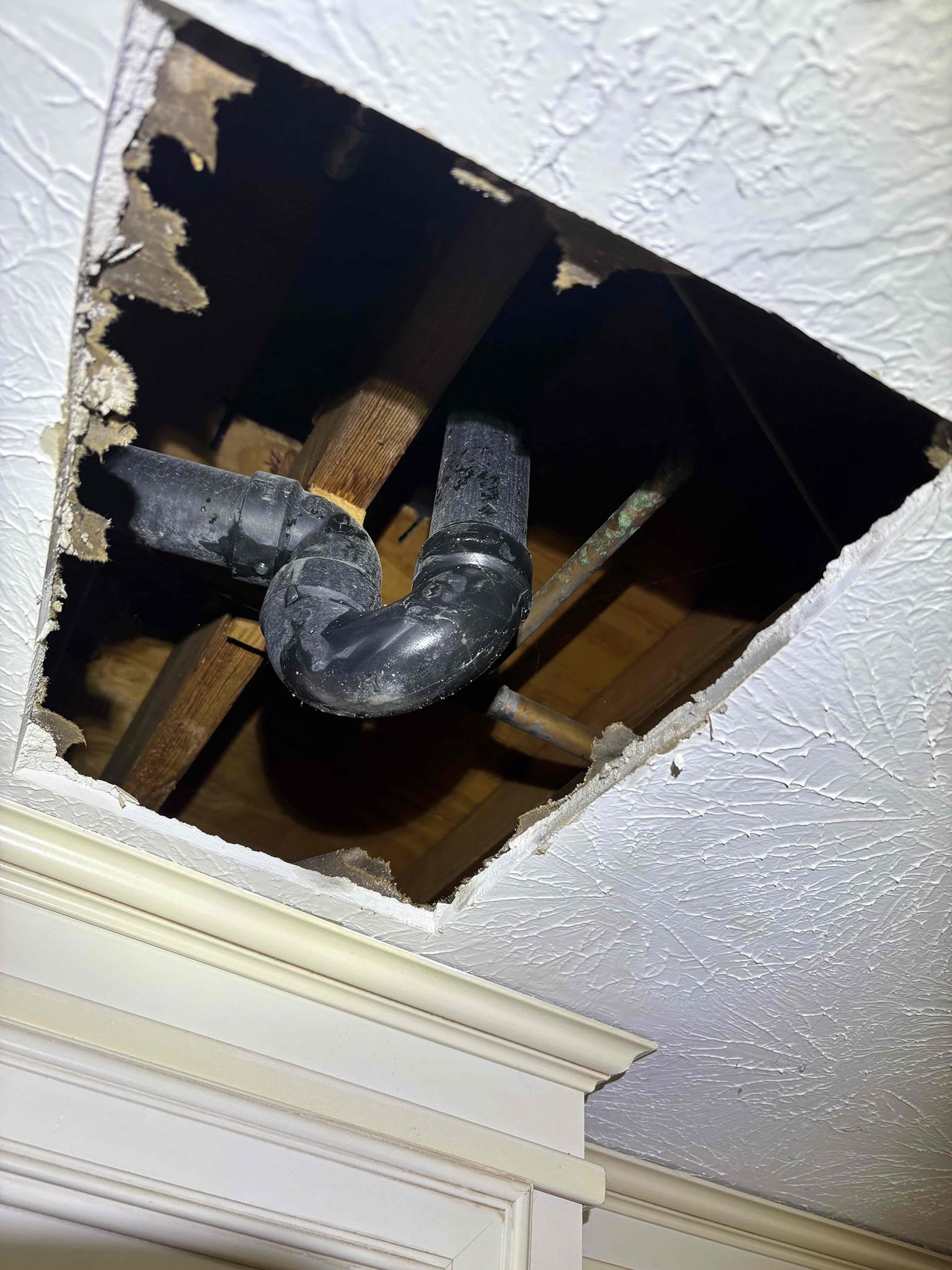 Called out due to a leak occurring in kitchen from bathtub above. Client had replaced the drain piece and reputtyd the drain and that repair was working fine. They only noticed it when the shower was used. There’s some grout cracks in the tile shower, and after some diagnostics we could hear water hitting the ceiling but didn’t see water. Opened the Sheetrock in that small square below and saw the water was coming down when we sprayed the shower walls. Also, client had a leaking pop up assembly in their main floor powder room lav. Replaced that leaking pop up with new brushed nickel push pop up assembly. Tested, no leaks and good to go. 
Home water pressure is good at 60 psi. 