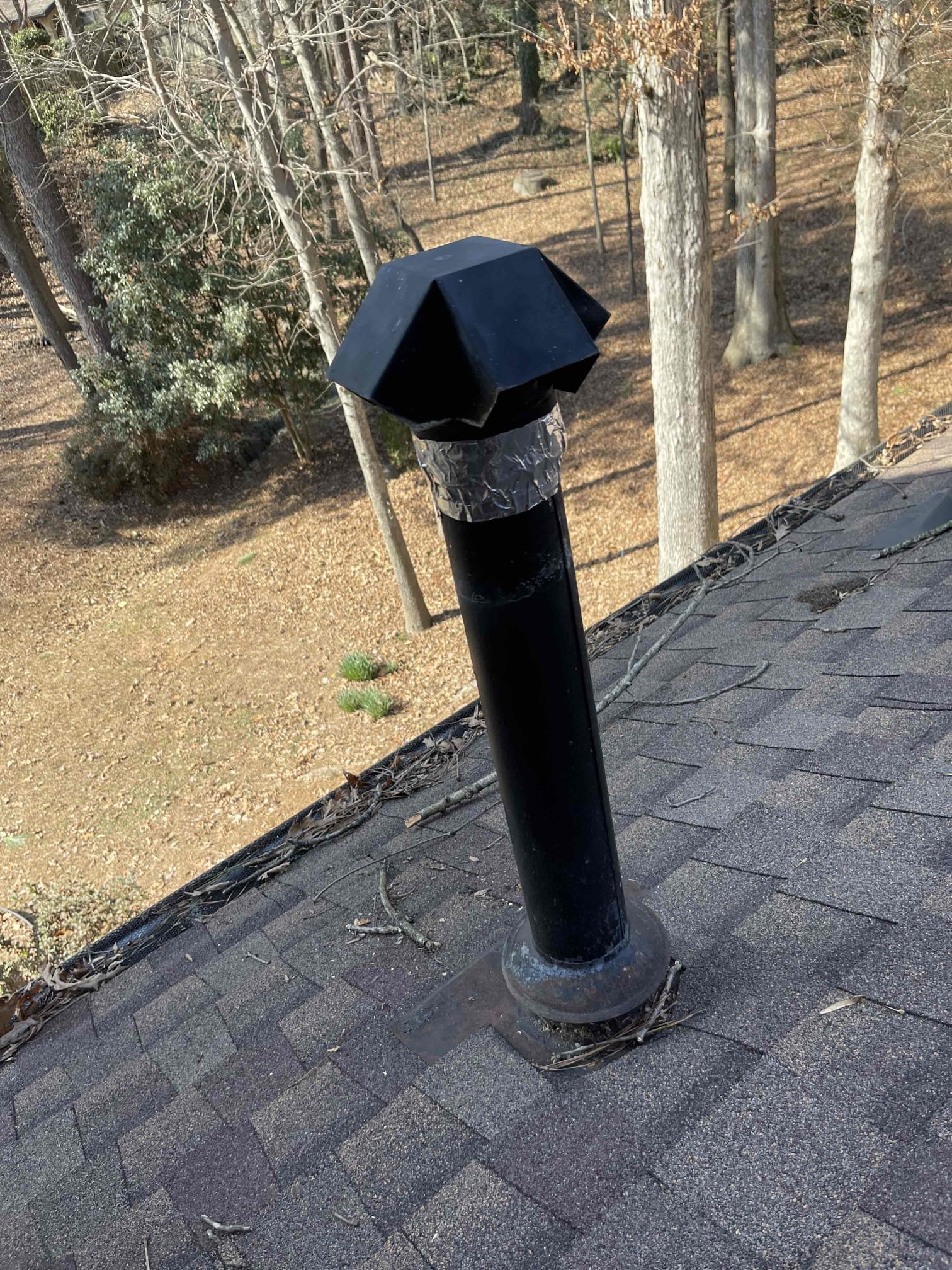 Replaced water heater in the garage. Installed new water heater on a stand per code as the old tank was not on a stand. After lighting the new water heater, we found it was back drafting. Went on roof and found the vent cap was only held on with tape and no screws. Vent cap had slid down over the vent and was obstructing the exhaust. Reinstalled the vent cap correctly. No further issue at this time. 