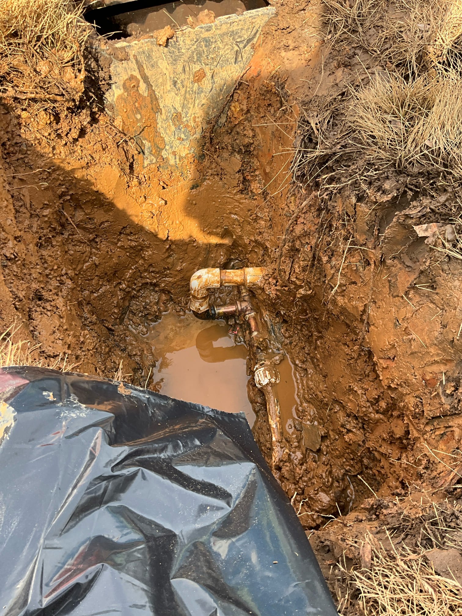 Call for leak in yard.

Met with Tom and he advised that the county utility service has been out and said the leak is on the property side. 

I dug down and exposed main and irrigation tee. I found a gas pipe black iron 90 transitioning to pvc leaking. Removed the leak in section and installed pex pipe to relieve tension on line. Pressurized system and checked for leaks. Meter is locked out and home is pressurized, lines clear of air. 

I recommend contacting the water service provider for. Bill adjustment if water overage is significant.