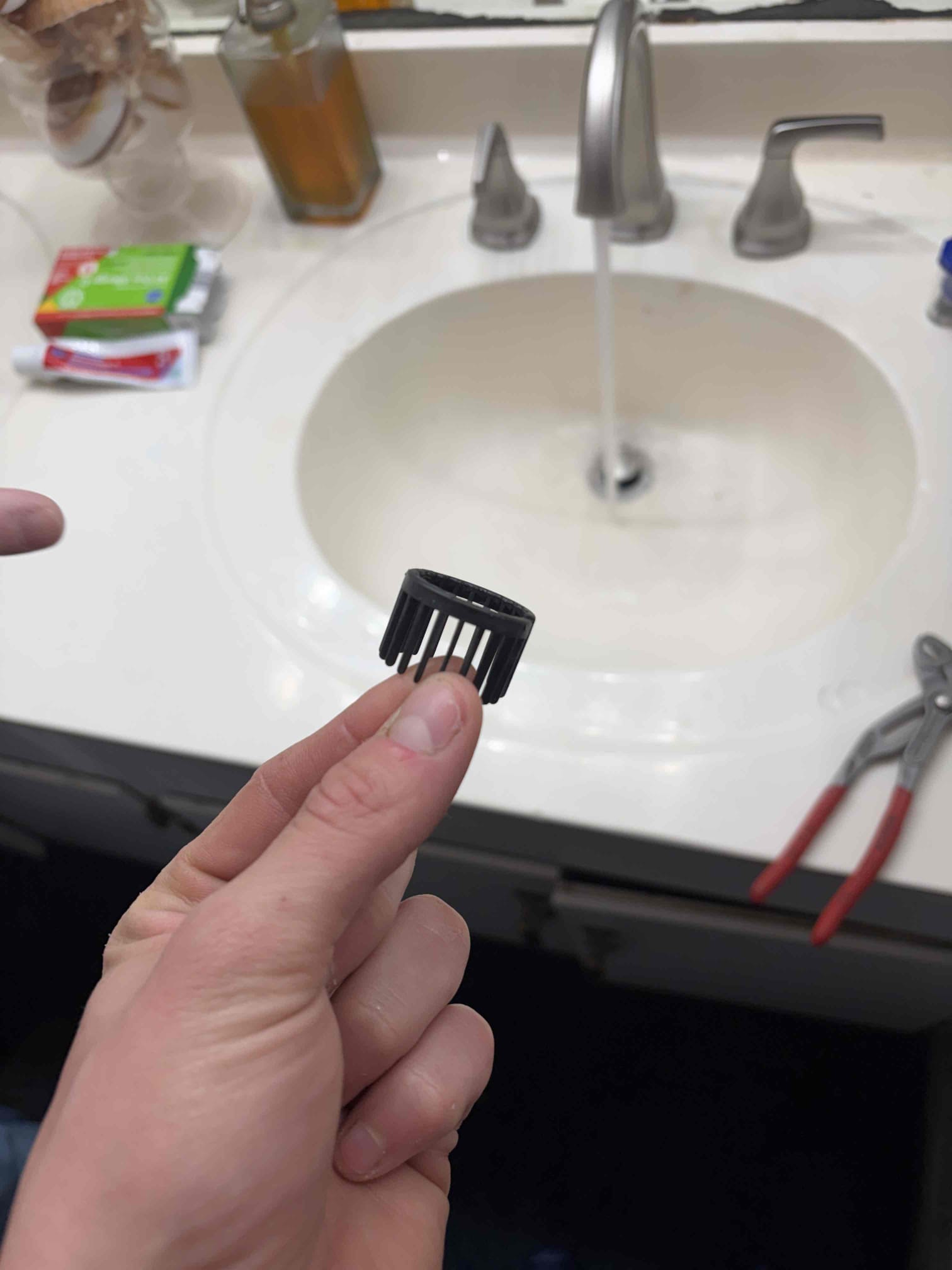 Installing the pop-up assemblies, it came with a drain catcher thing that will save pills or diamond rings from going down in the drain once we remove those the drain started flowing normally customer didn’t want them in so we took them out and the drains are draining normal