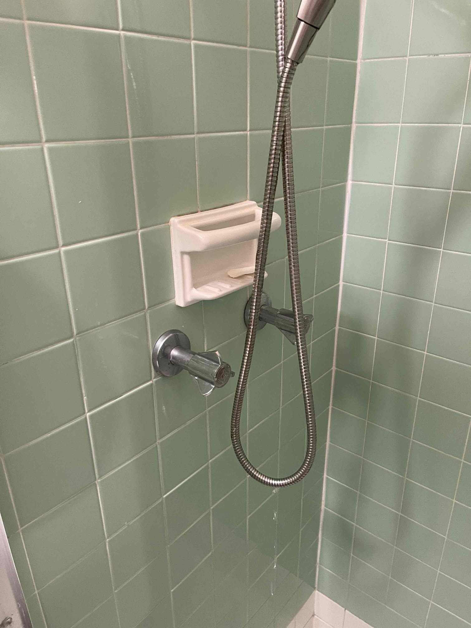 Two handle shower valve had constant leak on it. Customer did not want to replace it, and we would not have been able to cleanly replace it due to a soap holder that was tiled into the shower. Customer elected to just rebuild the shower valve with no warranty. We took the valve apart, went to handy ace and matched the stems and purchased a rebuild kit, returned and installed it. No further issue at this time. NO WARRANTY.