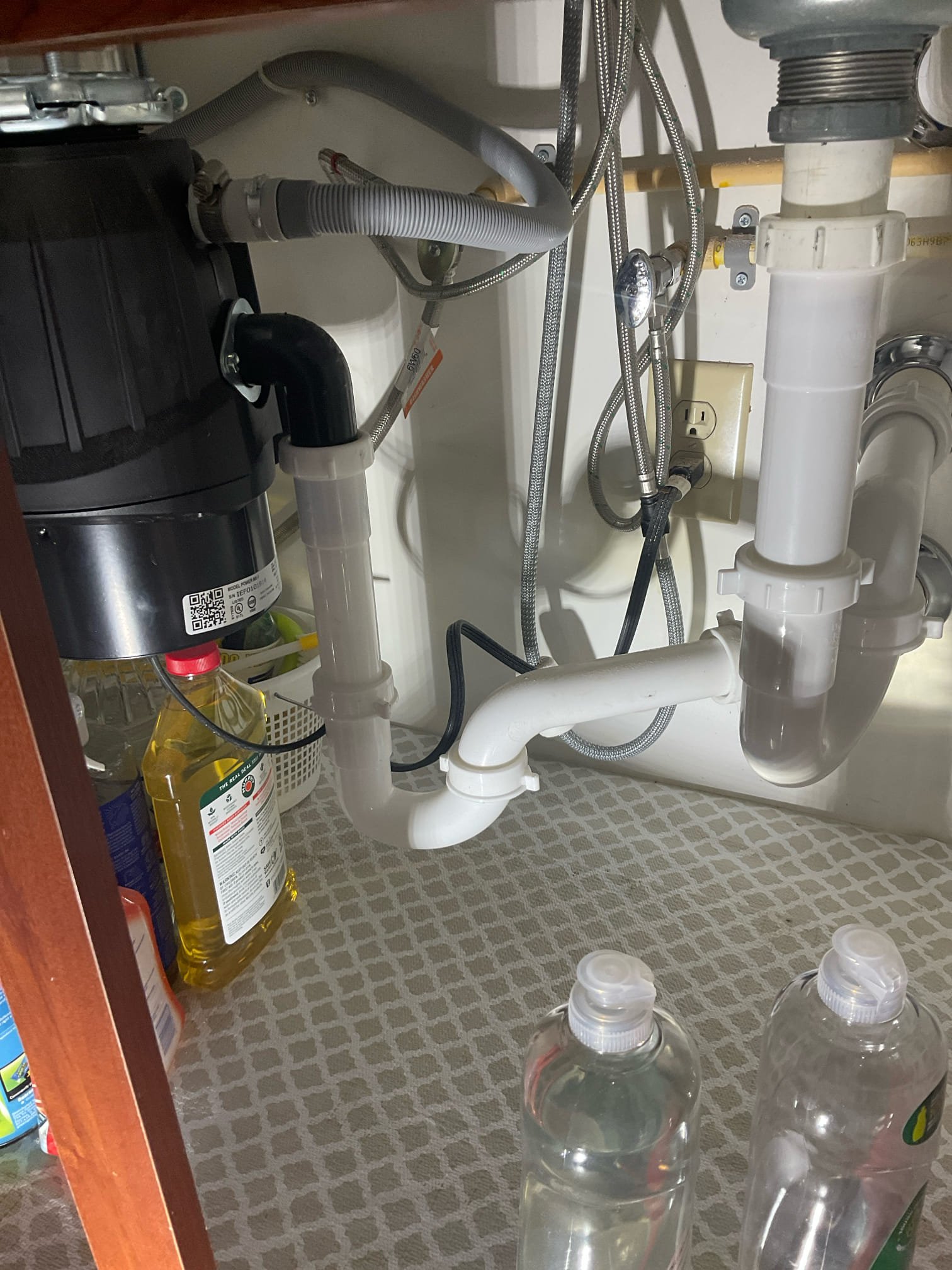 Replaced disposal , replumb with two p trap , snake and camera the drain , 