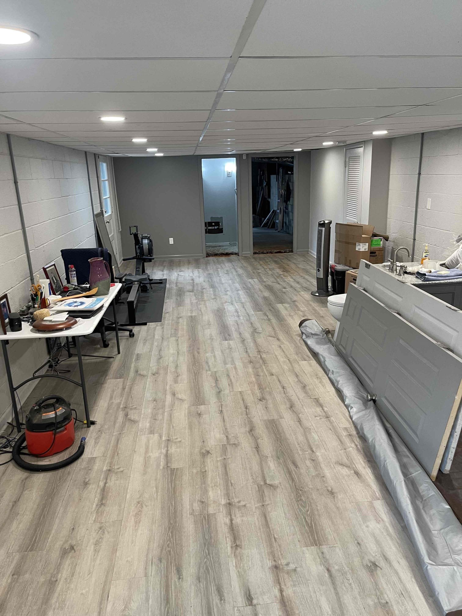 Returned Monday morning to replace the rest of the cast iron under the slab. We removed the vanity and toilet. Jackhammered through the slab and demo’d the bathroom where needed. Dug down outside foundation wall to have somewhere to tie back into temporarily. Cut out the cast iron pipe and replace up to the stacks above the slab so slab wouldn’t have to be removed again for any more repairs on the drains. We also replaced the drain going back to the lavatory sink. Tested to ensure a leak free installation and proper function. Left for the day. Returned Tuesday morning and dug with an excavator 30’ from the house and replace the cast iron outside. Found a section of concrete pipe to tie back into. Camera’d the rest of the line and confirmed no other active issues going on on the customers sewer line. Installed new pvc line and confirmed a leak free installation. Bedded pipe before back filling and grading yard. Returned Wednesday morning with a dump trailer and hauled off all of the con