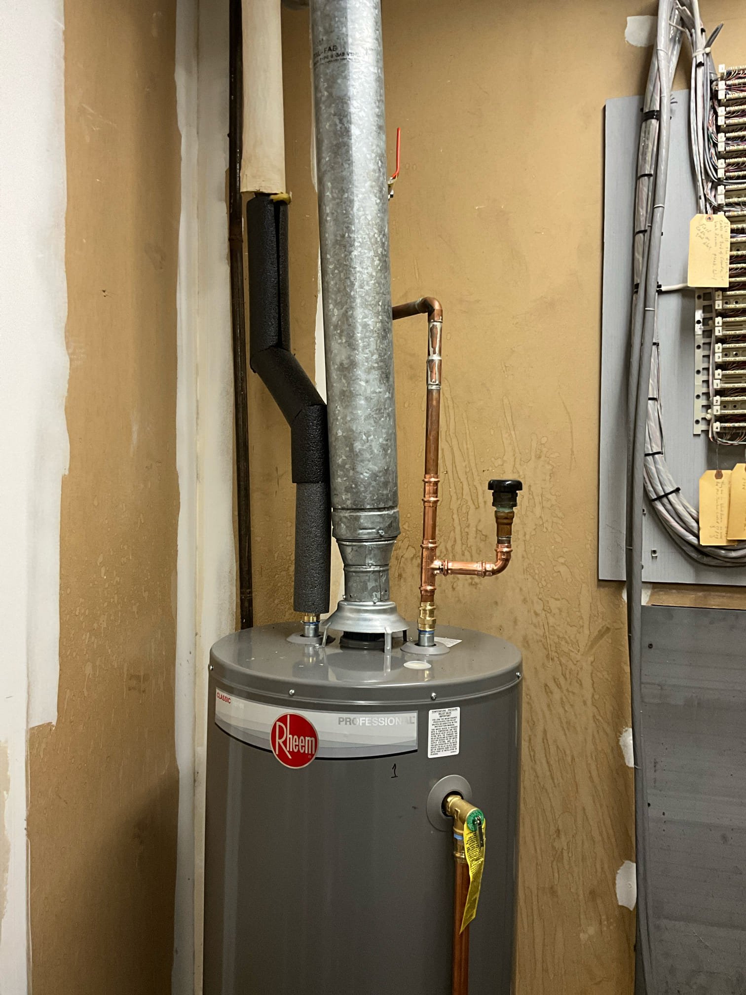 Return to install gas water heater and to hydrojet sewer main lines.

Removed water heater, and installed new gas unit. New insulation. Reworked gas line to accommodate correct sediment trap and remove sediment trap with incorrect tee configuration. Removed tension off copper waterlines. Lit unit and cleaned work space.

When camera and jet were used on main line I found that there appears to be. Buried sewer manhole or access. It is deeper than I was able to probe, and will likely require excavation before we are able to assess the viability of adding a riser or isolation box. However, the clean out inspection revealed a slight sewage slow down right before the suspected manhole chamber. Other than the slight belly, I do not see any indication of chronic backups or sewer issues. Pipe walls appear unblemished for as far as we are able to inspect.

I believe it would be prudent to pursue excavating the manhole or identifying the section of pipe seen in the video. If it is a manhole, it 