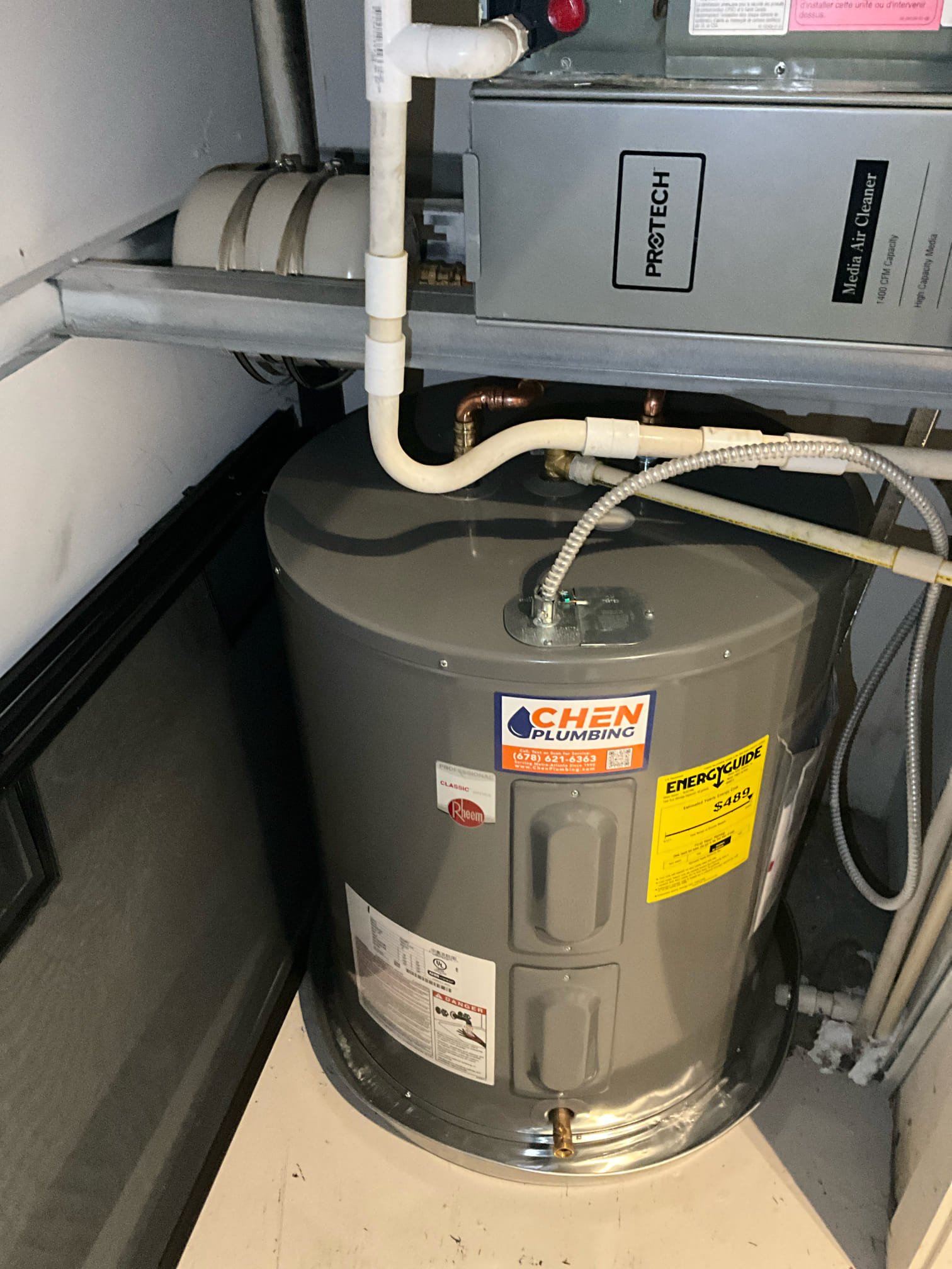 Returned and removed the old 50 gallon lowboy water heater and installed a new 50 gallon lowboy electric heater. Reconnected to existing water, electric, and t&p lines. Found a leak on the lower element from where a gasket pinched. Drained the tank back down and replaced the gasket. Tested all work to ensure proper functioning and no leaks. None were found. Waited for heater to produce hot water. 