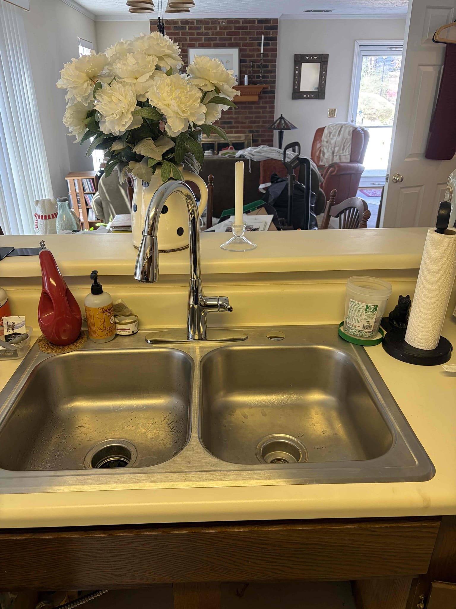 With CUSTOMER, he had to redo the icemaker waterline with new compression angle stop however we had to modify it the customers on a slab and the pipes come in from a really weird angle from the slab so we had to modify the compression angle stops. We replaced the hot and the cold and then we also replaced the icemaker waterline as well. Use the tea with the street 90 to make the drop connection in order to tile onto the waterline connection for the icemaker once complete. There are no leaks from the angle stops. The customer also wanted us to supply and install a brand new faucet so therefore we installed a chrome American standard faucet single hole with the plate Once installed there are no leaks. 