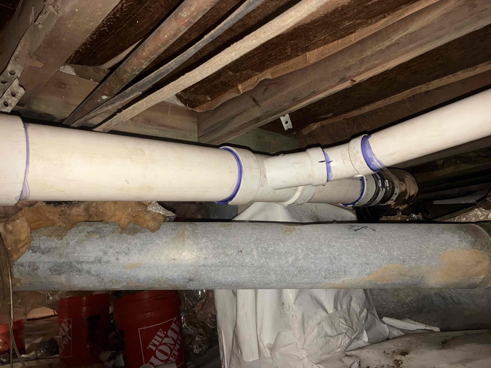 Customer had stoppage affecting multiple sinks on the left side of home. Attempted to run machine and camera through various points, clean outs, vents and other points of entry but was unable to clear system. Customer had approximately 50 feet of cast-iron left in home causing issue. cast-iron was very deteriorated inside line, determined to by camera. Gave customer options for cast-iron section re-pipe. return the following Monday to complete work, removed all trunk lines in crawlspace and reattached with new clean out outside, sealed penetration in wall, added test T in crawlspace below. reattach to all vertical portions of remaining cast-iron with approved connection methods after work was complete completed. Checked all areas for leaks ran a large amount of water to ensure proper drainage. Explain to customer about remaining cast-iron vertical sections. Also cut hole in wall in order to reattach to vent line explain to customer we do not repair areas that were cut. Lastly did minor