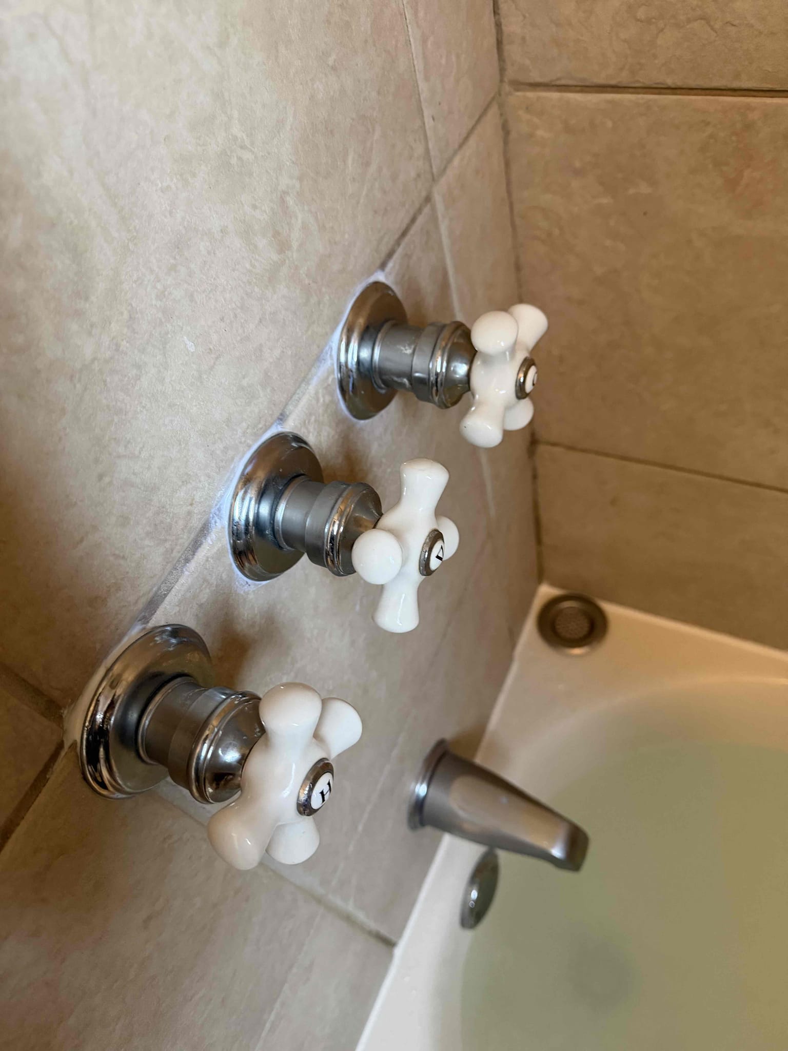 Tested all previous work, no leaks were present from previous work. Re caulked around shower trim. Stated to customer to have tenant to use shower heavily for a week so we can see if we can recreate the leak. Give caulk 12 hours to dry. 