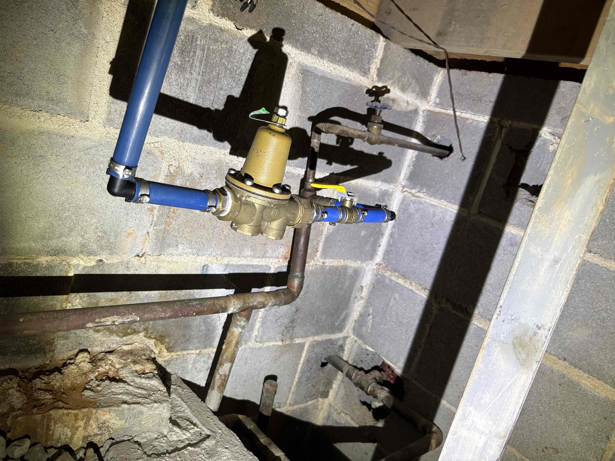 Client called us out to ensure the homes water pressure was not too high due to them having a few different leaks throughout the home in the recent past. Checked pressure at back hose connection, and home water pressure is good at 70 psi, safe range is 50-79 psi. Client has been experiencing a $600 water bill for awhile now so we looked at the water meter and he indeed does have a leak somewhere. When I turned off the ball valve inside the home, the water stopped running, indicating the leak is inside somewhere rather than outside. Went around and checked all the toilets In the home and none are running. In the crawlspace area I could hear the water running through the copper pipe just behind the wall running into the concrete slab for basement floor. 

Recommend client call National Leak Detection @ 404-579-1188 to have the, come out and locate the leak under the slab. So we can come back and give the estimate and perform the work repairing the leak under the slab. 

