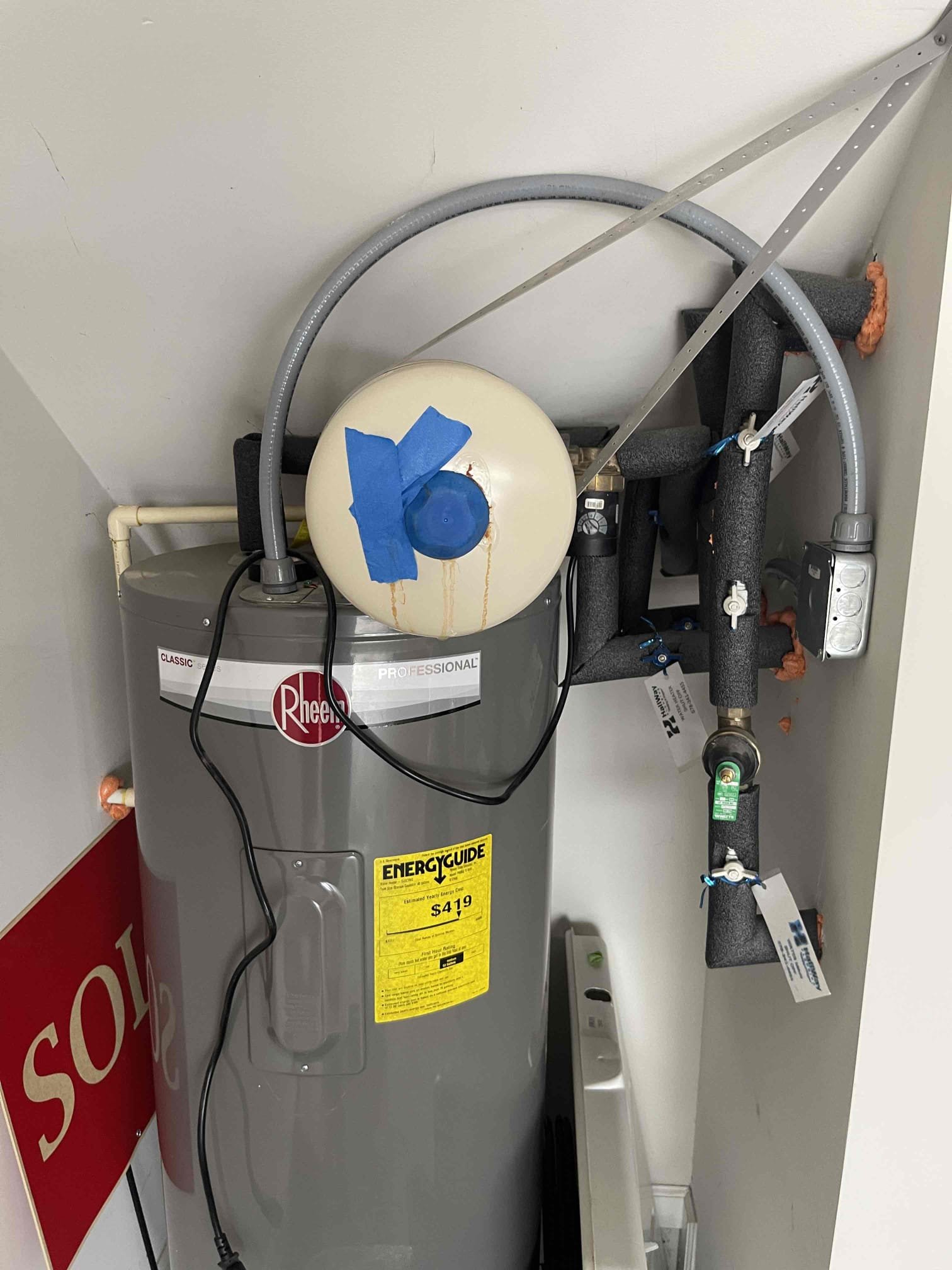 Expansion tank had rusted through and was leaking. Expansion tank failed due to how the builder connected the recirc pump. Hot water is getting pumped into the expansion tank and causing the rubber bladder to fail quicker than normal. Recommended having the recirc line repipe through the drain port whenever the tank gets replaced. Replaced expansion tank and set to 50 psi. No further issue at this time. We flushed the water heater at no charge since we had to drain the water heater partially anyway. 