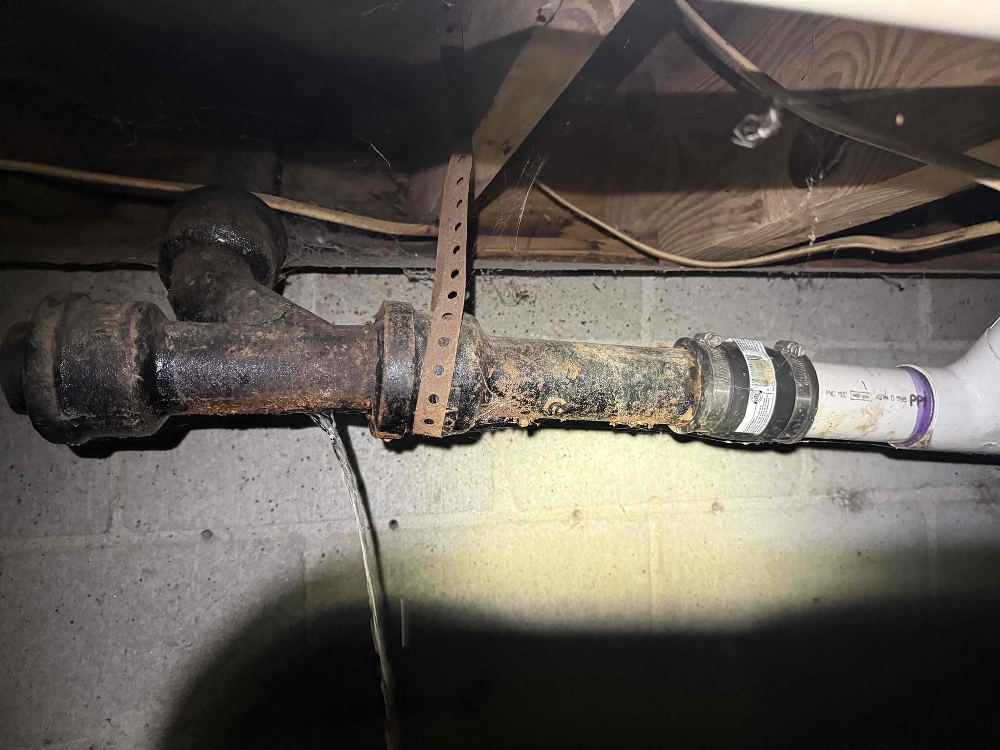 Cast iron leaking upon arrival. Customer stated her husband found a leak in the kitchen sink drain line. After going in crawlspace found cast iron Y leaking. Informed customer we could cut out the bad section and replace it with pvc. Gave customer estimate, customer approved estimate. Cut out bad section of cast iron and replaced it with new 2 inch pvc. Informed customer we cleaned as much grease out of the cast iron line as we could. Ran sink for 10 minutes and line was flowing properly with no leaks. Drain line is working properly and no leaks upon departure 