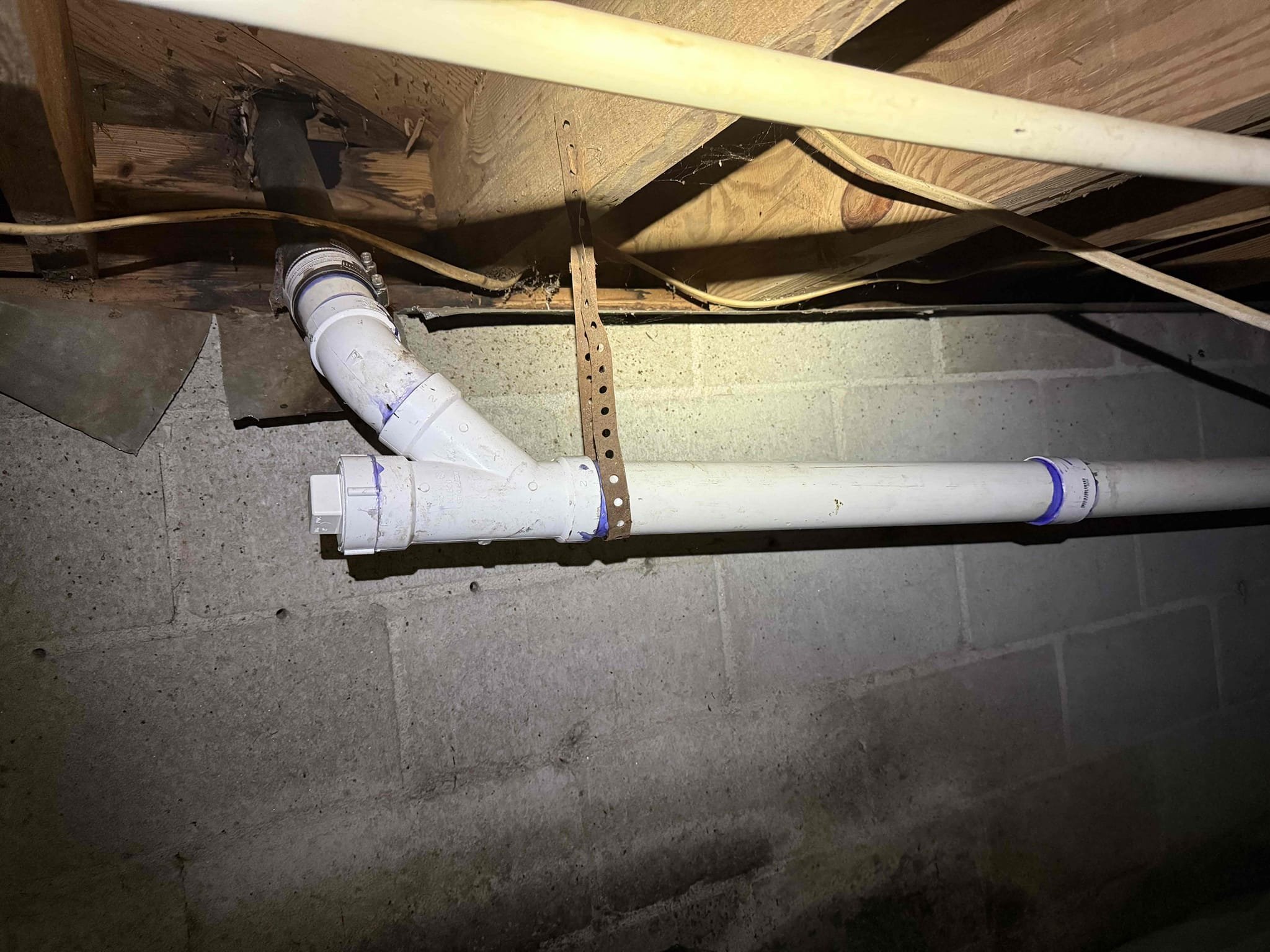 Cast iron leaking upon arrival. Customer stated her husband found a leak in the kitchen sink drain line. After going in crawlspace found cast iron Y leaking. Informed customer we could cut out the bad section and replace it with pvc. Gave customer estimate, customer approved estimate. Cut out bad section of cast iron and replaced it with new 2 inch pvc. Informed customer we cleaned as much grease out of the cast iron line as we could. Ran sink for 10 minutes and line was flowing properly with no leaks. Drain line is working properly and no leaks upon departure 