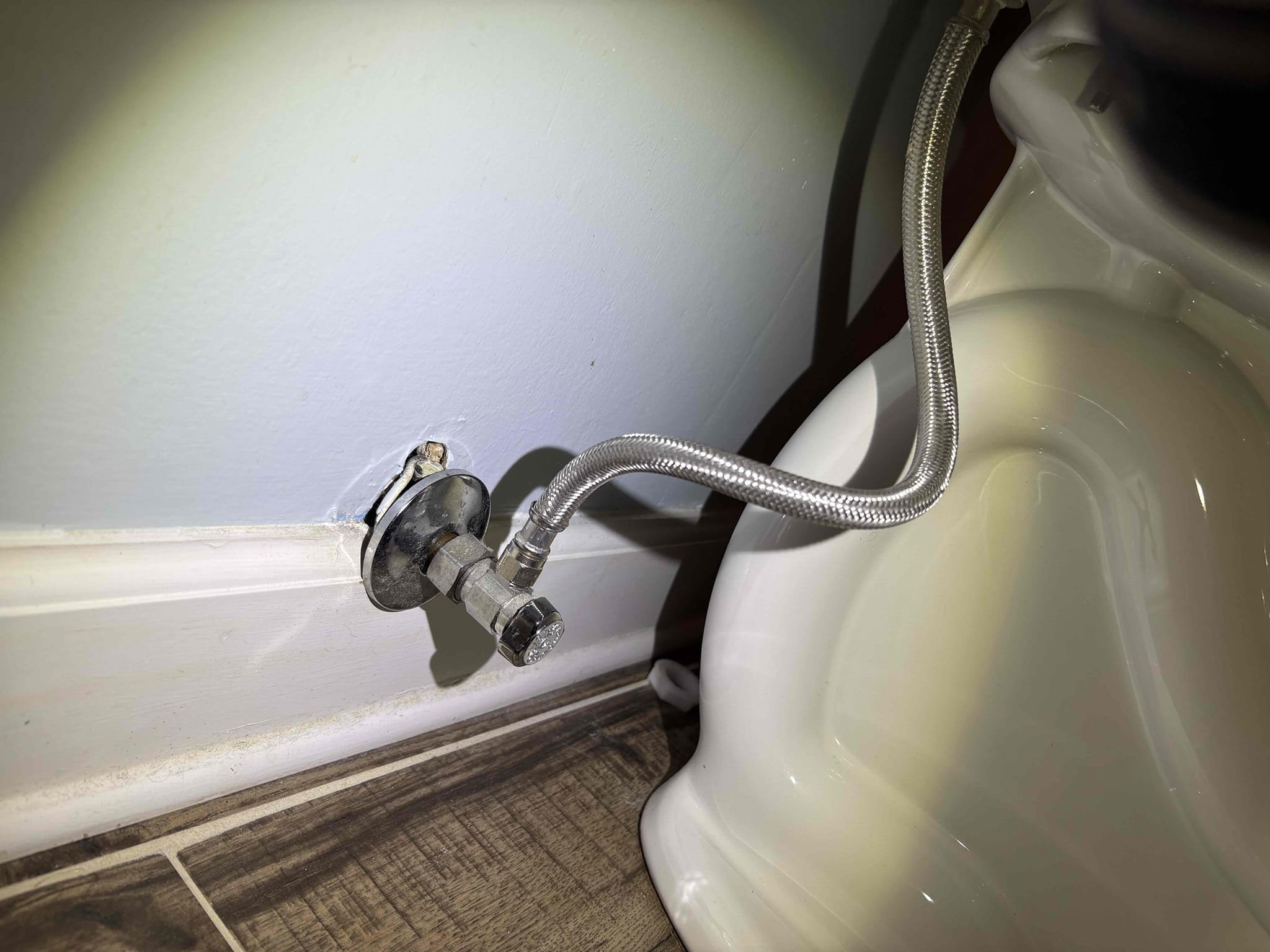 Client called us out due to a water leak causing a very high water bill. Client had noticed the main floor bathroom toilet running constantly. We checked the other toilets in home and the upstairs hall bathroom toilet was also somewhat running. Checked water pressure and it was over 110 psi, safe range is 50-79 psi. Also, the thermal expansion tank on the dual nat gas water heaters had failed and was hanging full of water, due to the high water pressure in the home. 

Client does have a leak outside on the irrigation system, BUT we were able to stop that leak by turning the system off. Client has irrigation guy coming this week. 

We replaced the failed pressure reducing valve and added new ball valve shutoff and set home water pressure to 60 psi. 
We also replaced the failed thermal expansion tank that was not properly supported nor sized correctly, with new 5 gal expansion tank on a mounting bracket secured to the brick wall with anchors. Also added a ball valve on cold side of the w