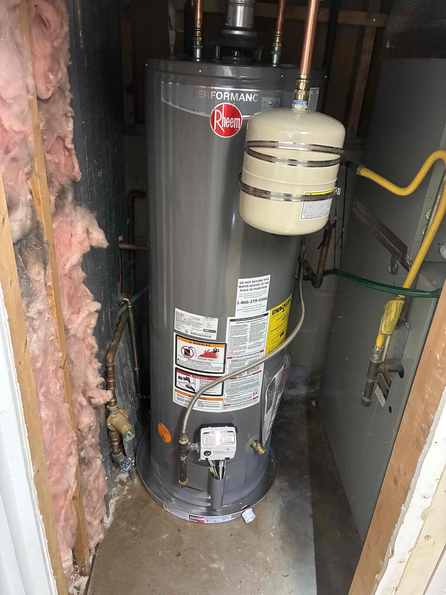 Customer had 40 gallon gas water heater leaking at base. Reviewed work and gave customer options for replacements of heater. Replaced heater with 40 gallon Rheem gas heater. Replaced ball valve and thermal expansion tank with bracket also added pan under heater. After work was completed checked for leaks in proper function, while running water in kitchen sink to remove air from hot line. drain line began to back up unexpectedly. Gave prices to run drain equipment in order to clear line, was unable to clear from underneath sink. attempted to clear drain line from roof access in vent but again was unable to clear. gave customer options for jetting from roof, but customer wanted to wait for further work explained to customer about Pricing adjustment for Jetter work and also clarified with customer that drain is still not draining properly.