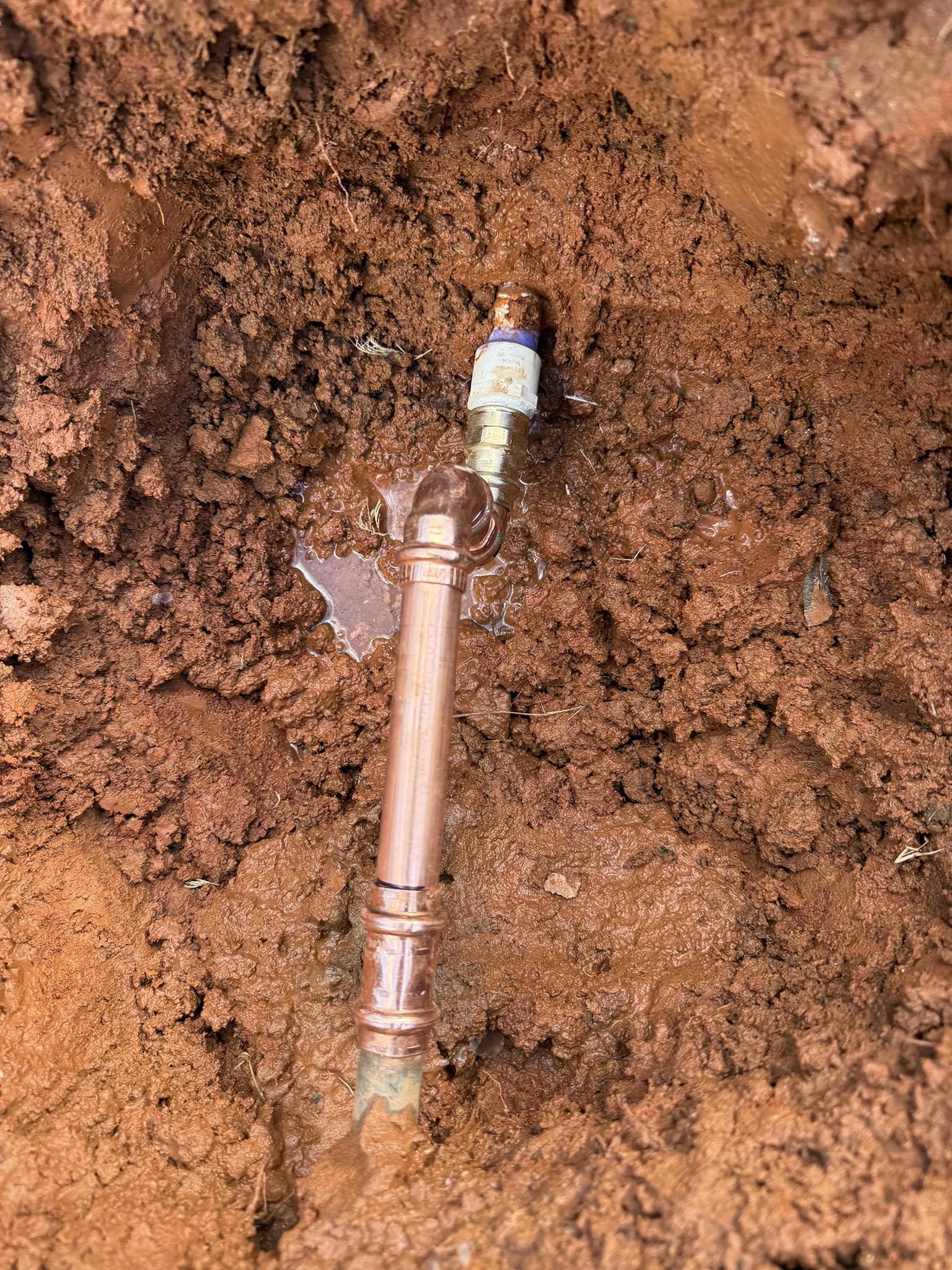 Water service leaking upon arrival. Customer stated he came out this morning and noticed water running down his driveway. After digging found pvc line cracked and leaking. Informed customer we could cut that section of pvc out and retie back to the copper. Gave customer estimate, customer approved estimate. Cut out broken section of PVC and replaced it. Turned water back on to check for leaks. No leaks were found. No leaks upon departure 