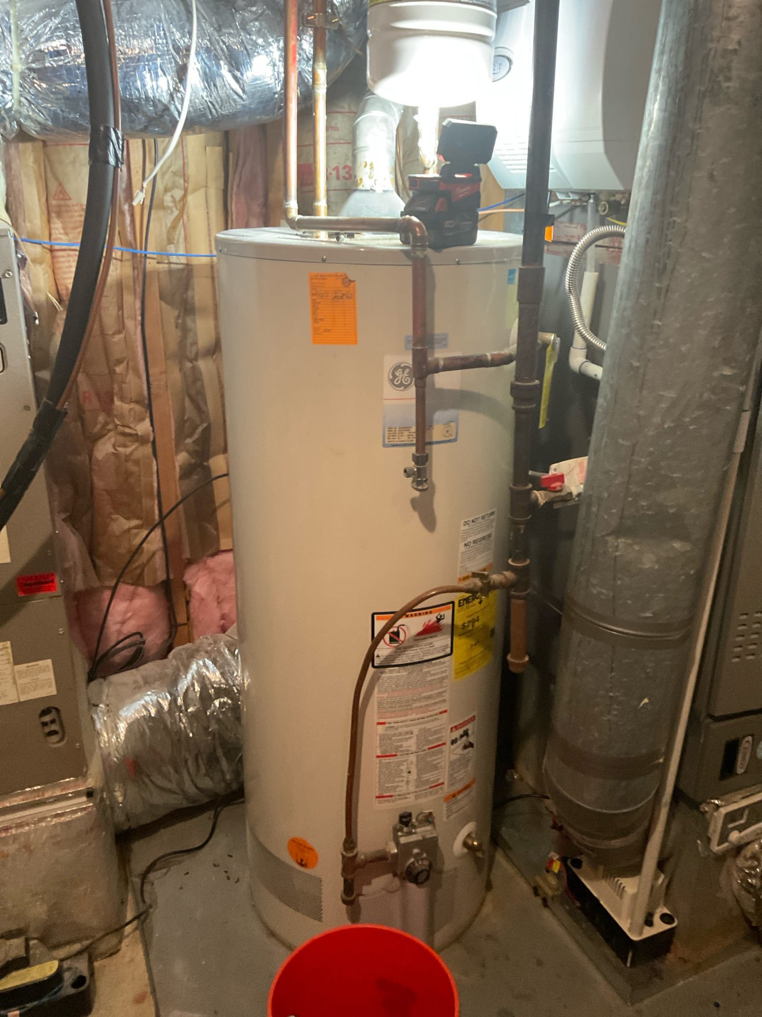 Leaking 40 gallon electric water heater in basement, Replaced a 40 gal electric water heater and 50 gal gas water heater all together, pan and new expansion tanks installed . 