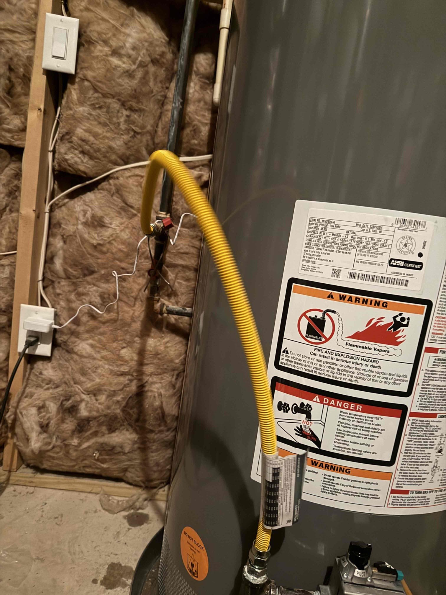 Gas leak upon arrival. Customer stated he smelt gas in the basement near the water heaters that we installed last month. After doing a gas leak detection found gas whip leaking. Replaced gas whip at no charge to customer. Gas leak is now fixed and water heaters are fired back up