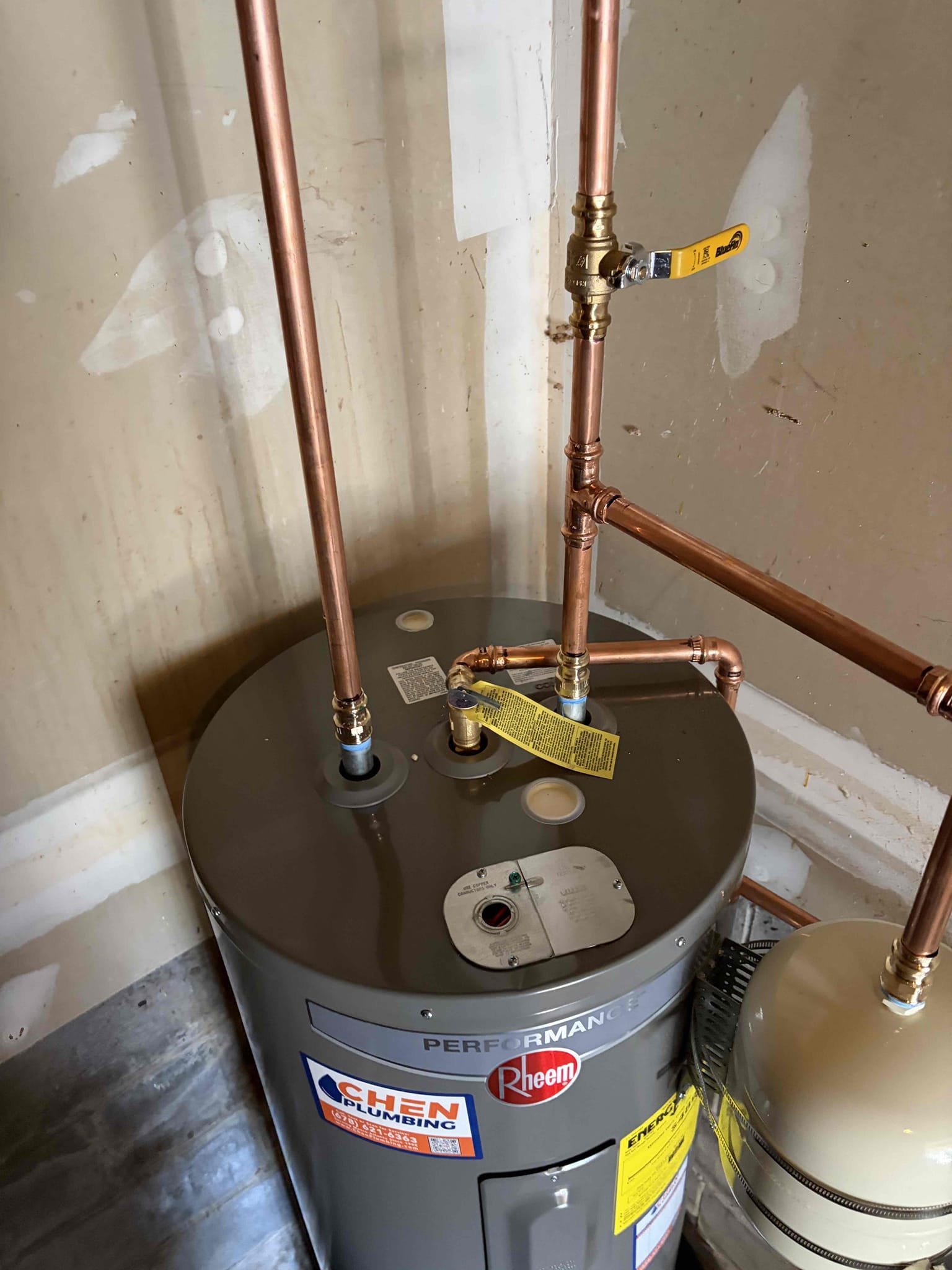 Replace the preexisting gas water heater with an electric water heater, an electrician will have to come back and wire up a whip and a electrical panel for the new electrical water heater, customer is responsible for hiring a electrical contractor.

For this customer we needed to repair and or replace the water heater, the due to code violations, the vent pipe wasn’t connected to the water heater, the cpvc pipe on a gwh, the water heater was leaning, on the wood platform, was deteriorating, the expansion tank was not supported. 

So what we did is, replace the 40 gallon gas  water heater with a 50 electric water heater, and the electrician would out after me to install the quick disconnect, and run the wire. We are not connecting the water heater to power the electrician will be doing that. We brought the water heater up to code, adding a thermal expansion tank, supported with a bracket, installed a new plastic pan for the electric water heater, followed by installing a new ball valve.