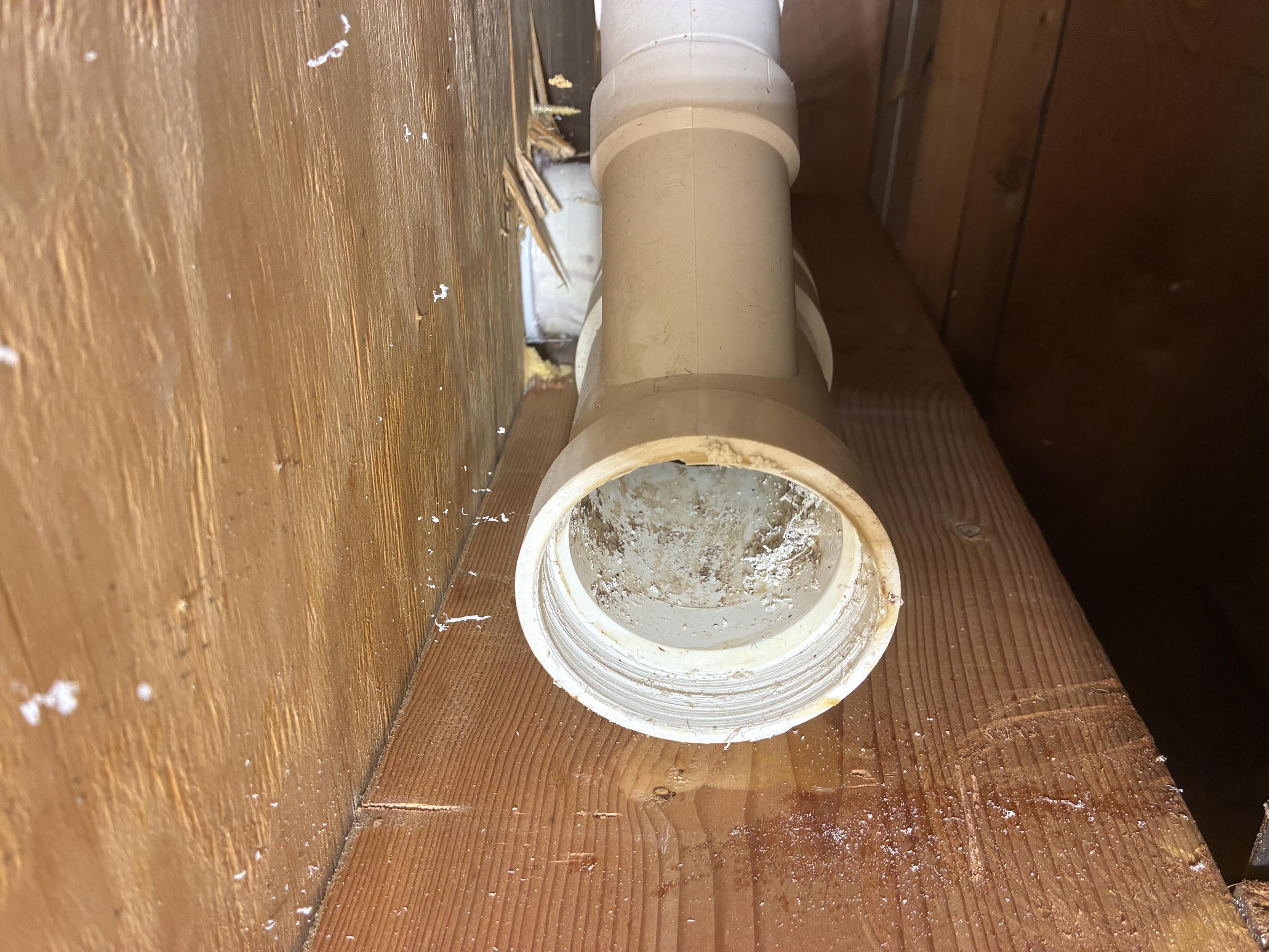 Call for leak near toilet after recent toilet installation.

Arrived and met with Ms. Paula. She said she came down last night and noticed water in the same area as our last visit. 

We inspected and checked all plumbing, and kept Ms. Paula informed as we progressed.

Inspection revealed that was was coming down and traveling along a three inch pvc line, but not the main level toilet line. This line is a couple feet away and serves the master bathroom, specifically the toilet and the shower. After investigating we determined we needed to open the wall and ceiling. Once open, we found a 90 degree elbow joint that was cracked and leaking when the toilet and shower were ran. During a prior visit, we found water dripping from the main level toilet, as well as on the floor, from a loose toilet. While the toilet was loose and leaking, I believe today’s leak was being masked by the toilet issue. We also resolved a soft tissue clog at no charge while on site. 

During this visit we repaired th