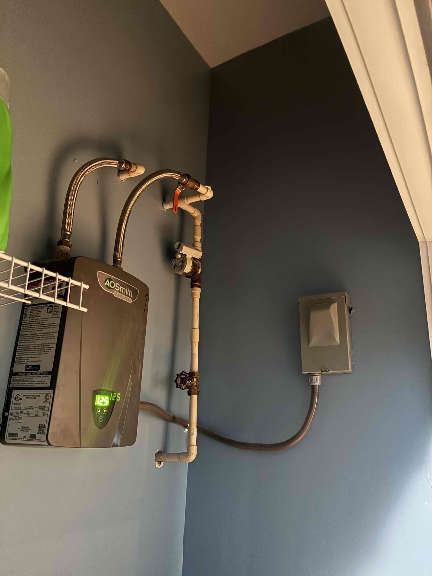 Diagnosed toilet not flushing well. Checked toilet and flushed. Toilet is smart toilet and does not allow enough water through for a good flush. Recommend traditional toilet to resolve issue. Also looked at electric tankless unit on wall near washing machine. Found tankless unit to be undersized and not efficient enough for the space. Recommend going back with tank type unit suspended from ceiling by thread rod. 