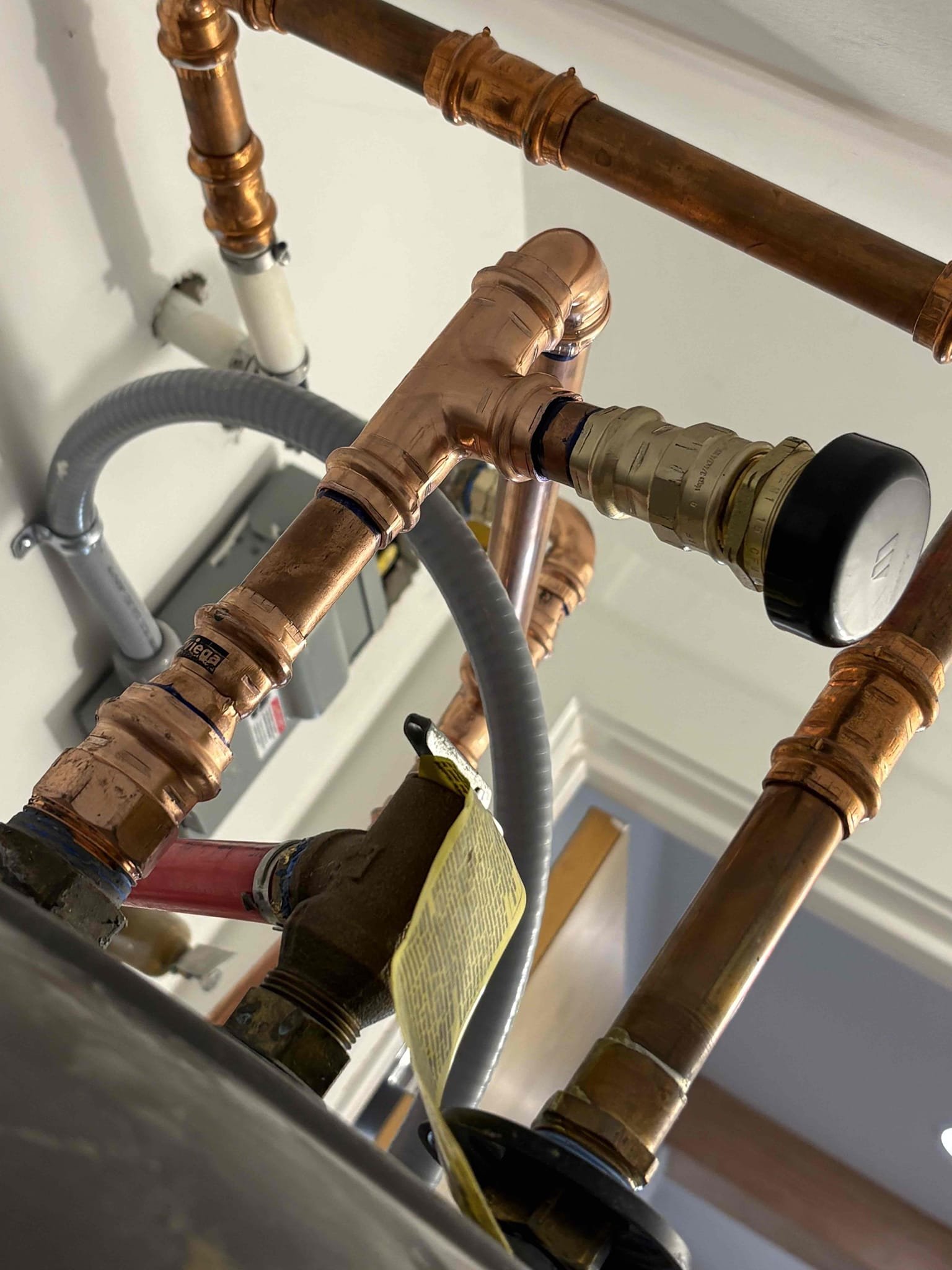 Client called us out due to a leak on their 10 yr old 50gal marathon electric water heater. I determined the leak was coming from the vacuum relief valve just above the cold water inlet of the water heater. Did not see any more leaks on the unit. 
We repiped the cold side of the water heater with all new fittings, new vacuum relief valve, and new properly supported thermal expansion tank, pumped up to match home pressure. After all work was complete fill tank back up and got air out. Put the electrical disconnect back in and powered on the water heater. No more leaks, everything seems to be working as it should be. 

1 yr warranty